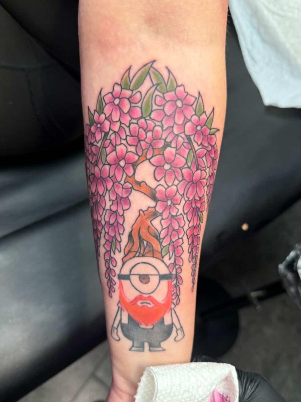 Minion with beard new school tattoo on the forearm by 👾 not ur baby’s ink 👾