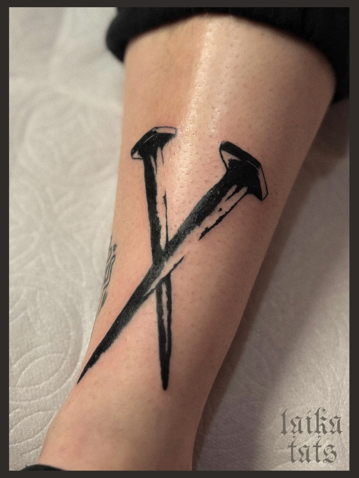 Crossed nails black and grey tattoo on the forearm by laika ✶ pdx tattoo, Portland, Oregon