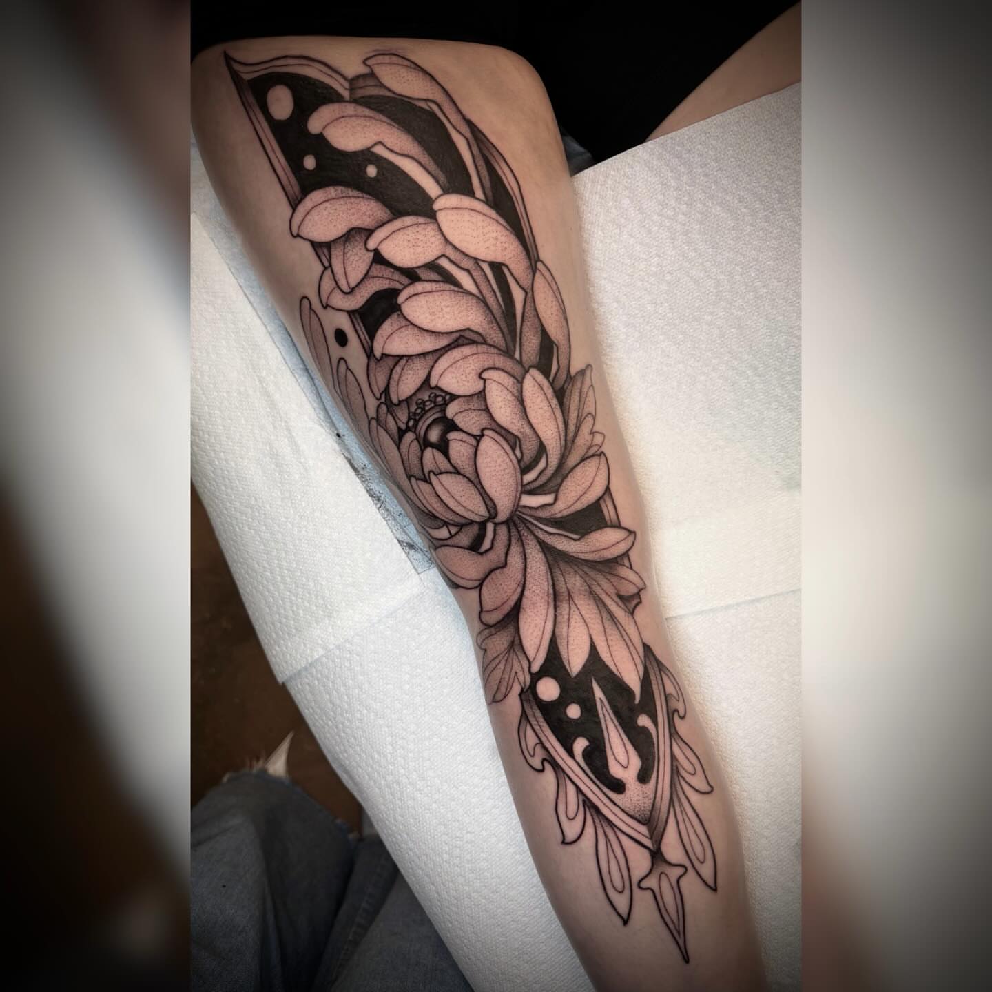 Floral design dotwork tattoo on the forearm by Alyssa Deeghan
