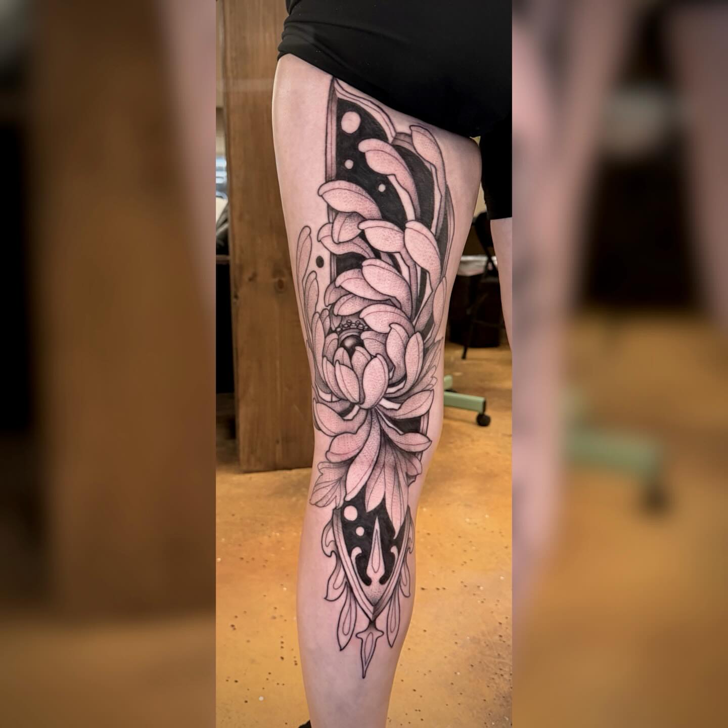 Floral design black and grey tattoo on the thigh by Alyssa Deeghan