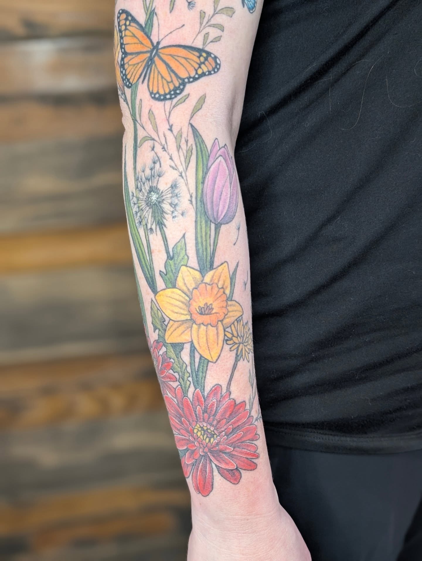 Floral arrangement new school tattoo on the forearm by SHOP53 Tattoo & Art