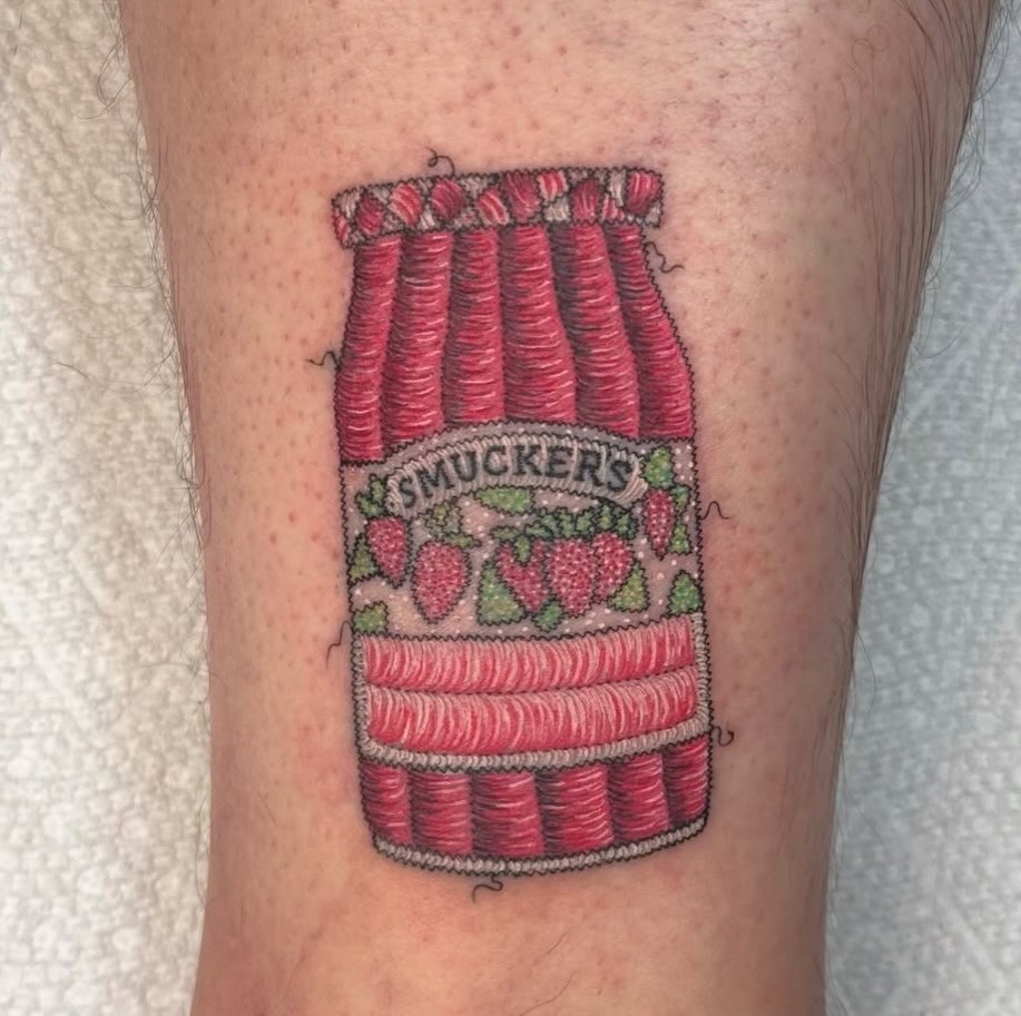 Smucker's strawberry jam jar realism tattoo on the forearm by Max