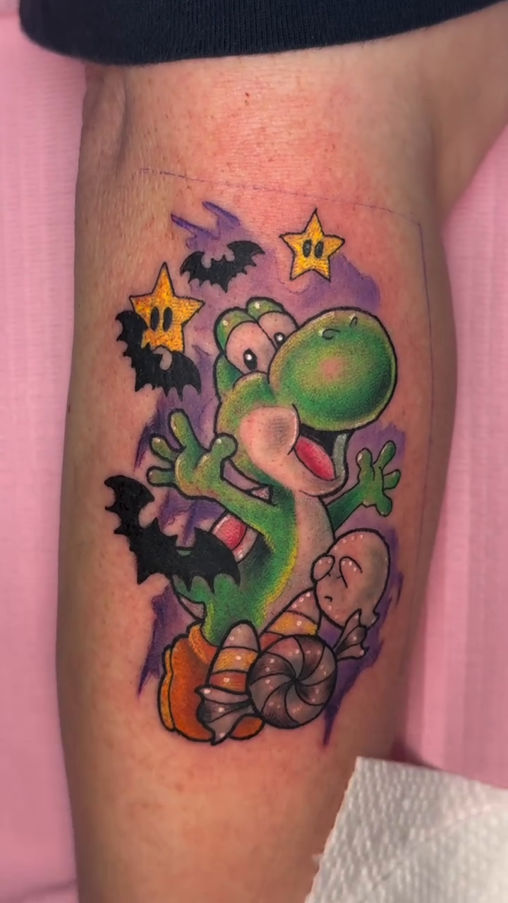Spooky Yoshi new school tattoo on the forearm by Erin Peterson