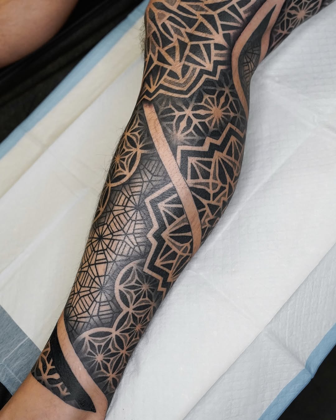 Tattoo by @rjxdots — geometric, blackwork