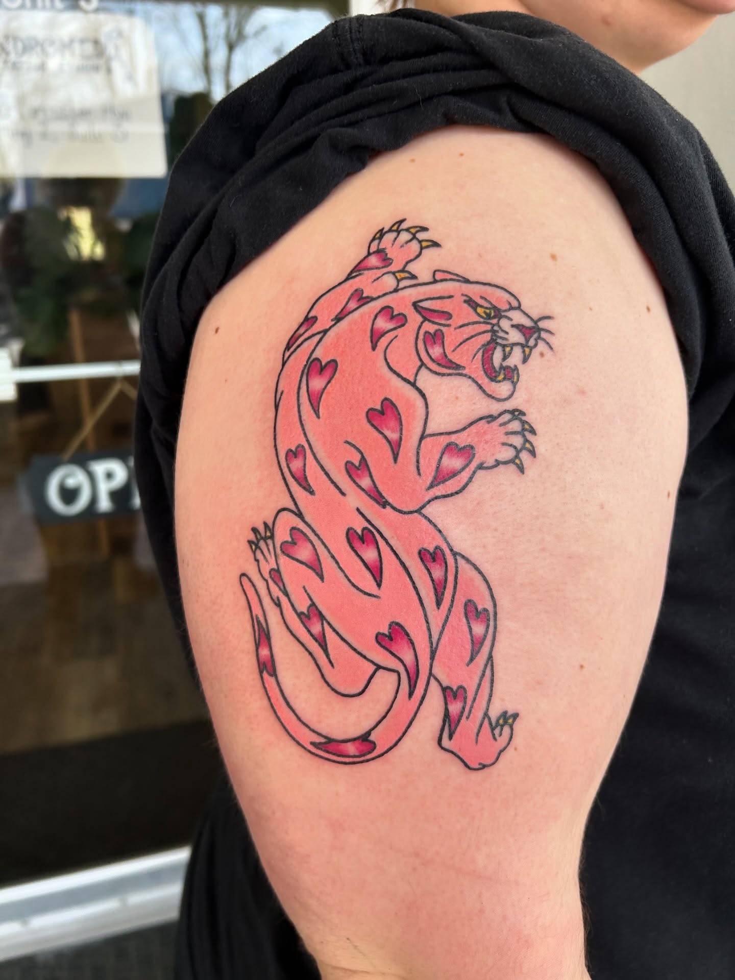 Panther trash polka tattoo on the shoulder by Courtney