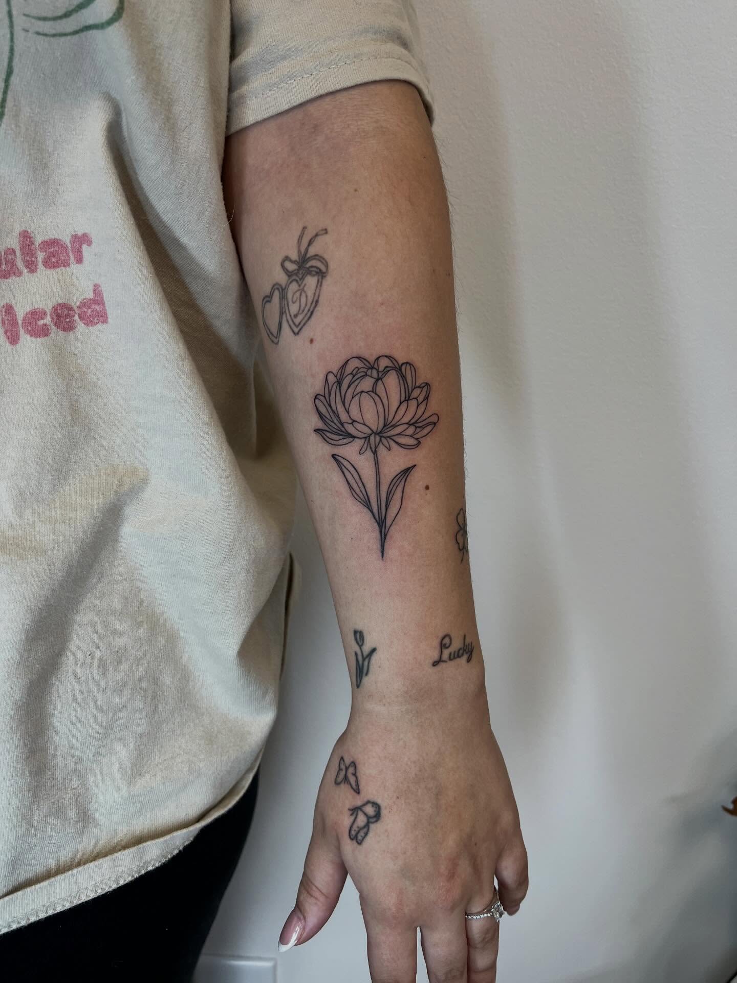 Flower black and grey tattoo on the forearm by Presley Tattoos, Murfreesboro, Tennessee
