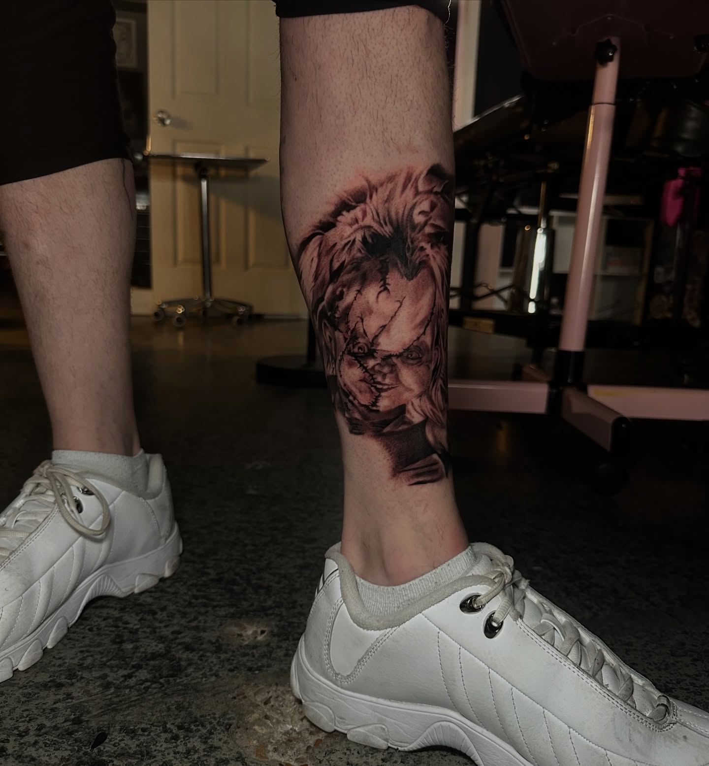 Chucky doll realism tattoo on the calf by Elizabeth’s Eclectic Tattoos