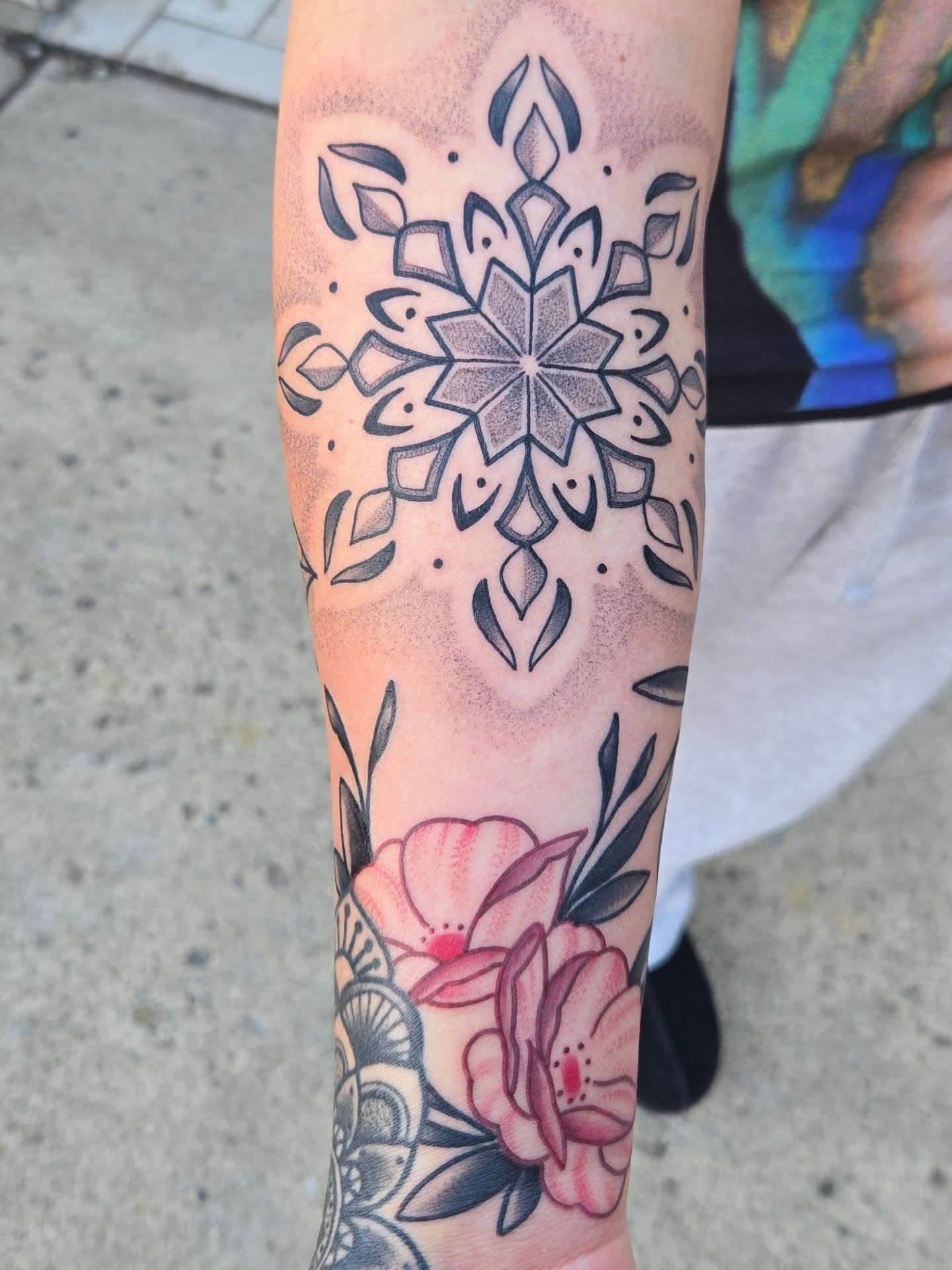 Floral mandala dotwork tattoo on the forearm by Angel O'Connor Tattoos