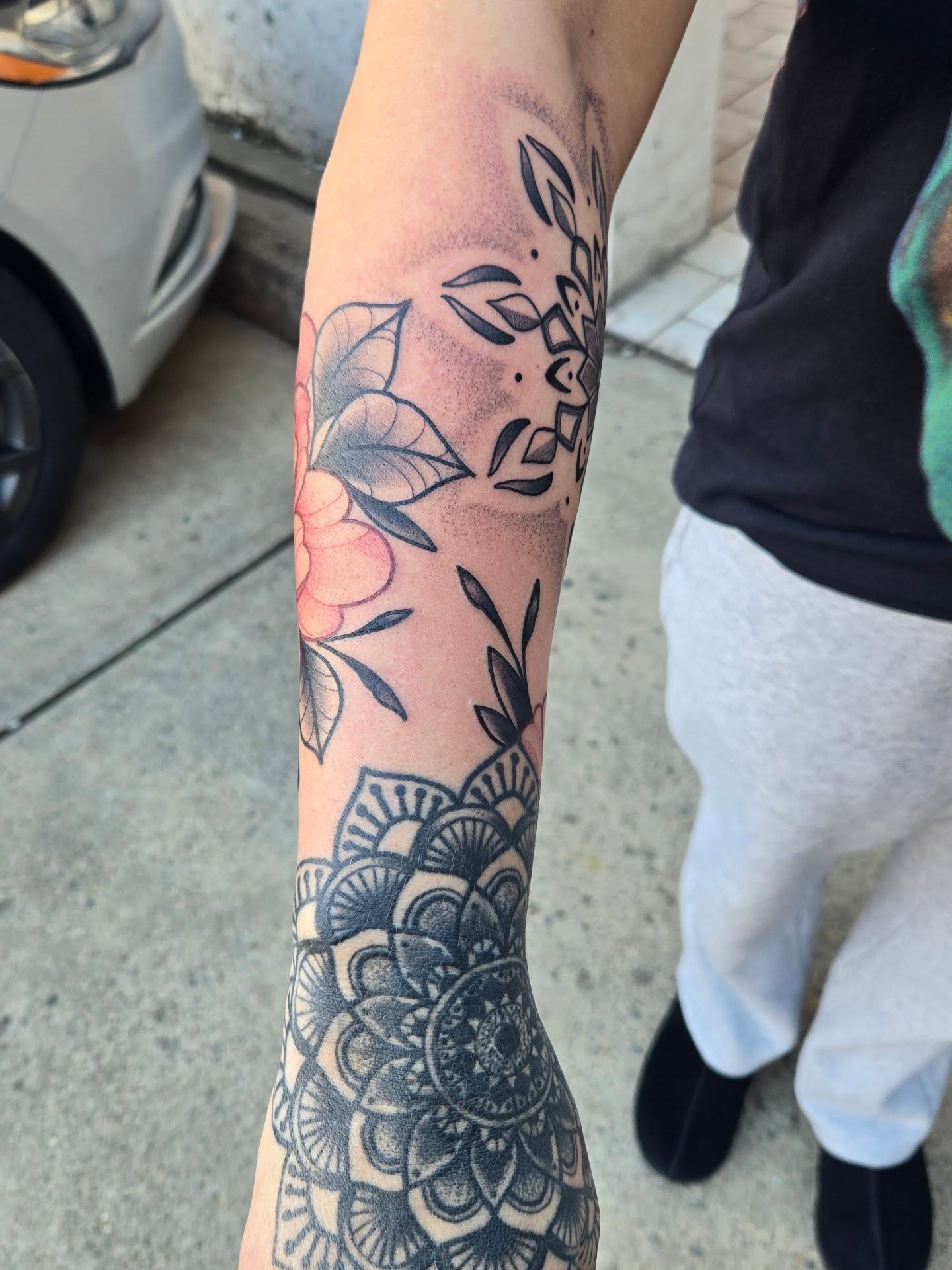 Floral mandala dotwork tattoo on the forearm by Angel O'Connor Tattoos