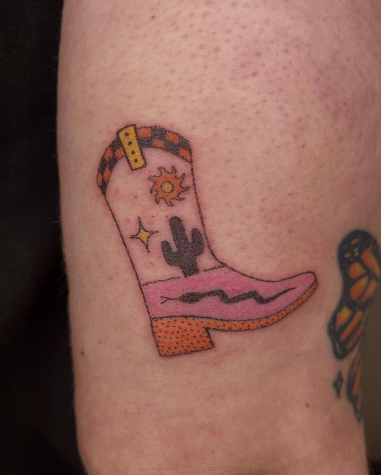 Cowboy boot new school tattoo on the forearm by Jenna