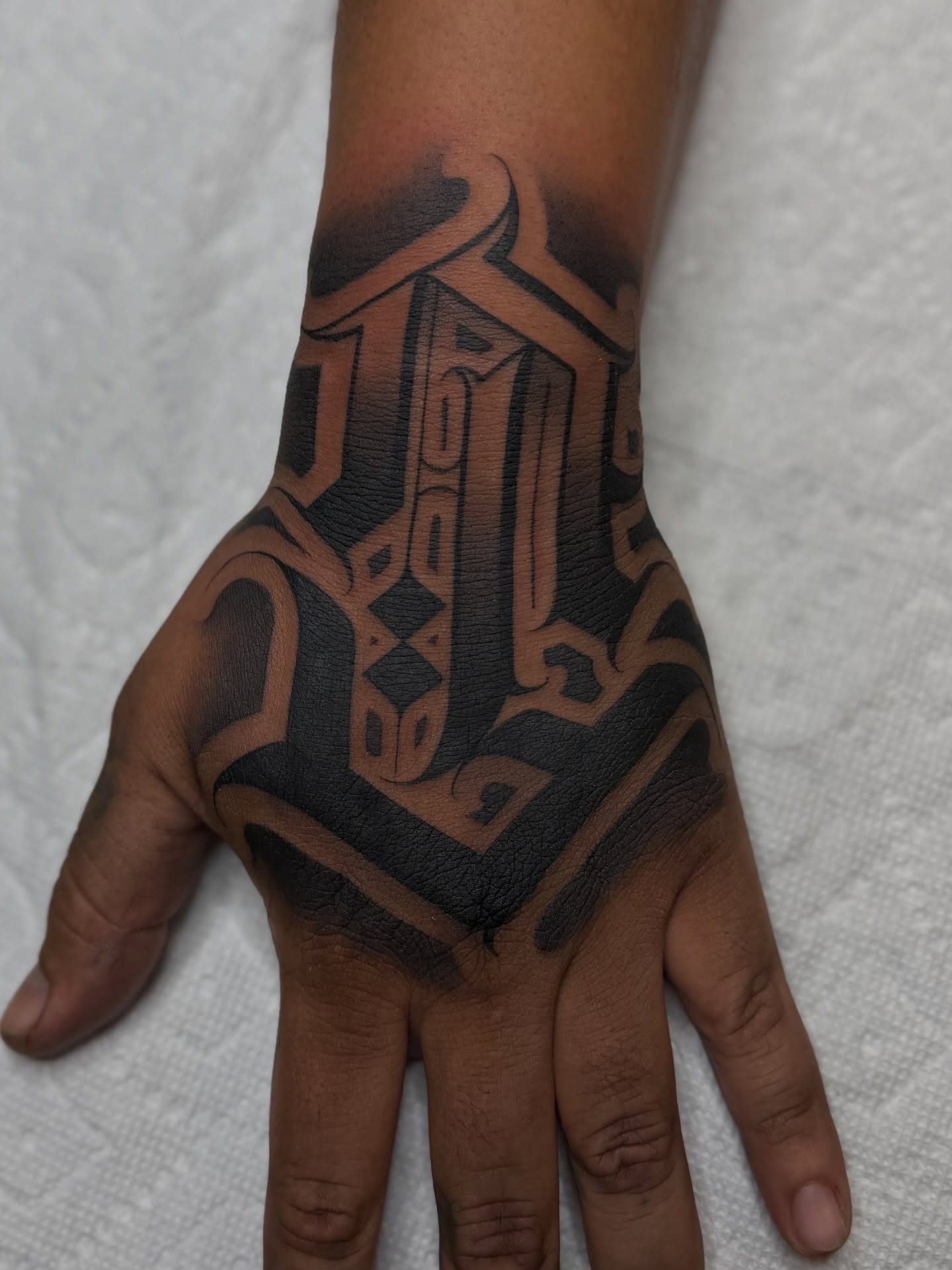 Geometric pattern geometric tattoo on the hand by Rocky G Inkz LLC