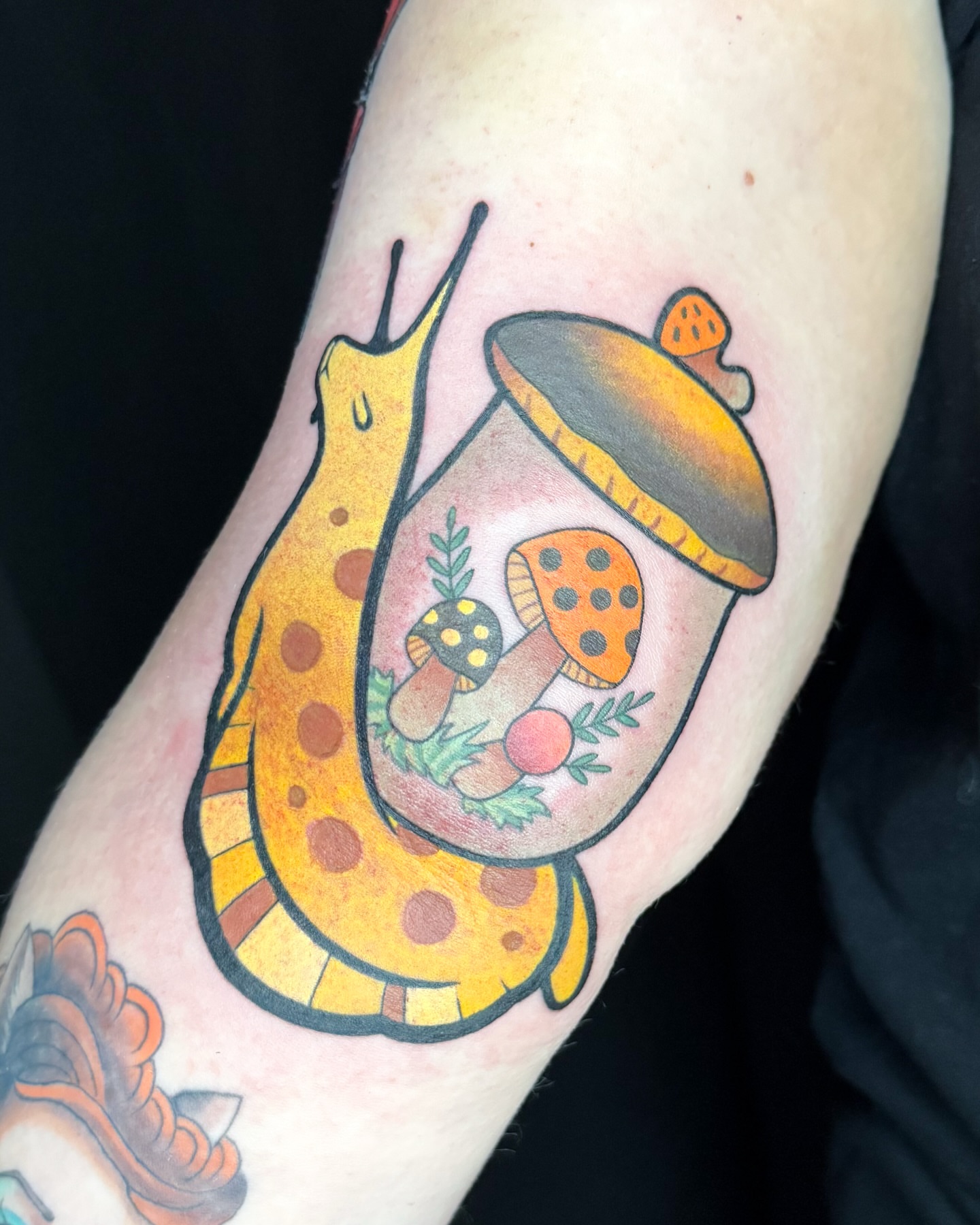 Snail and mushroom terrarium dotwork tattoo on the forearm by Janine Ramos