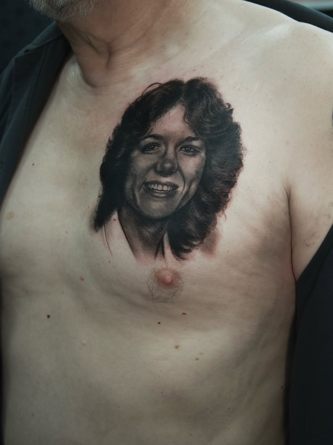 Portrait of a woman realism tattoo on the chest by Akos Strenner