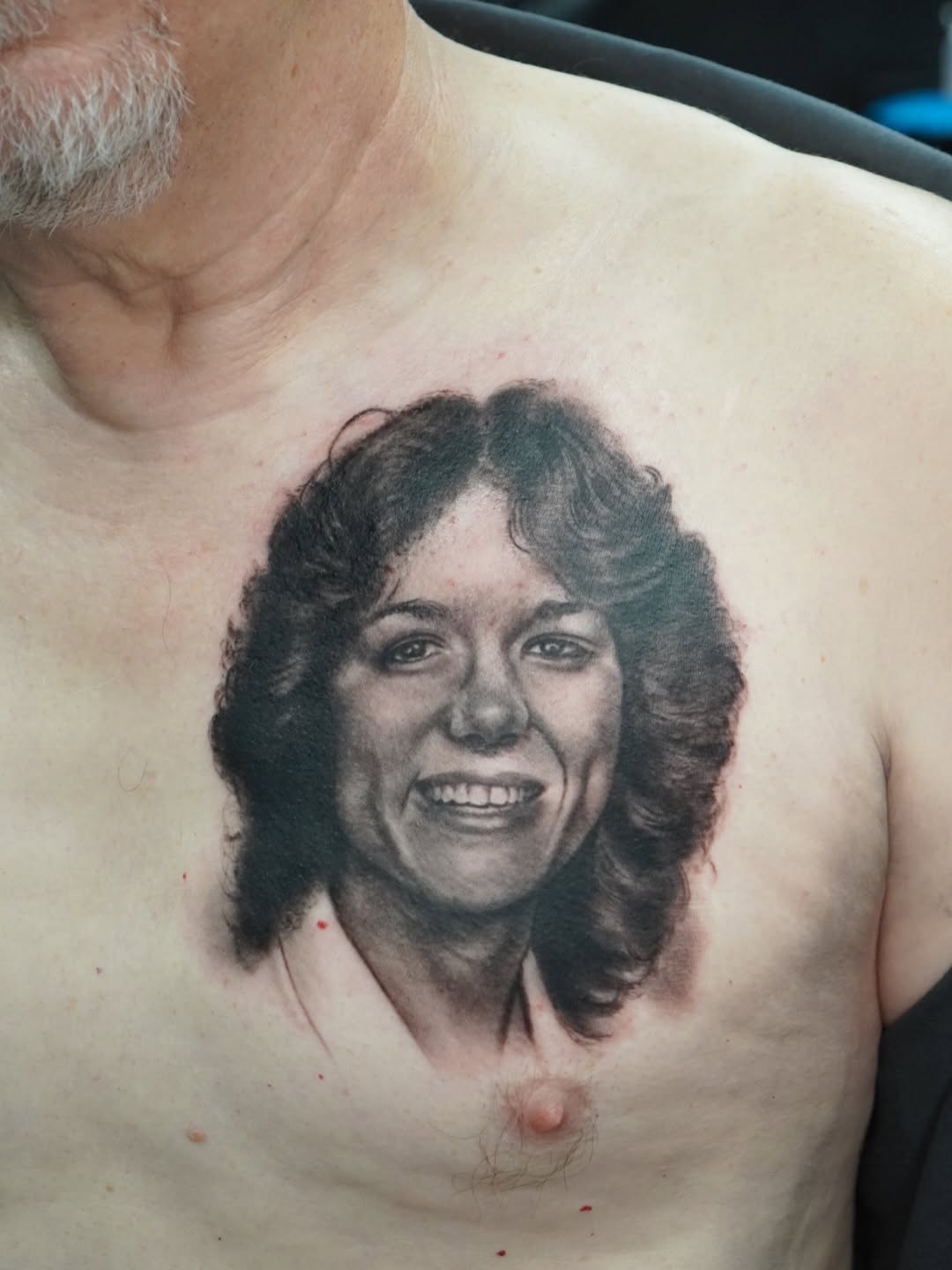 Portrait of a woman tattoo on the chest by Akos Strenner