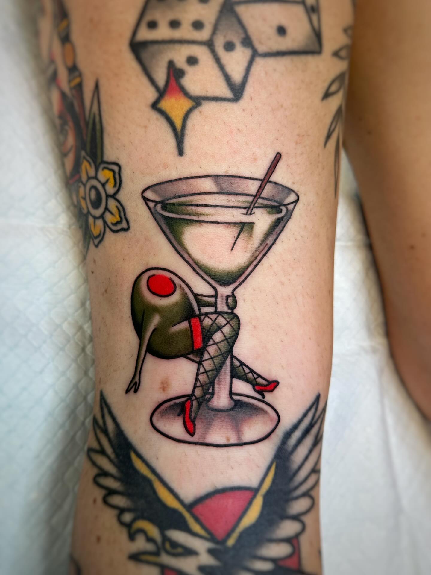 Martini glass with woman American traditional tattoo on the forearm by Alex Finnerty, Reading, Massachusetts