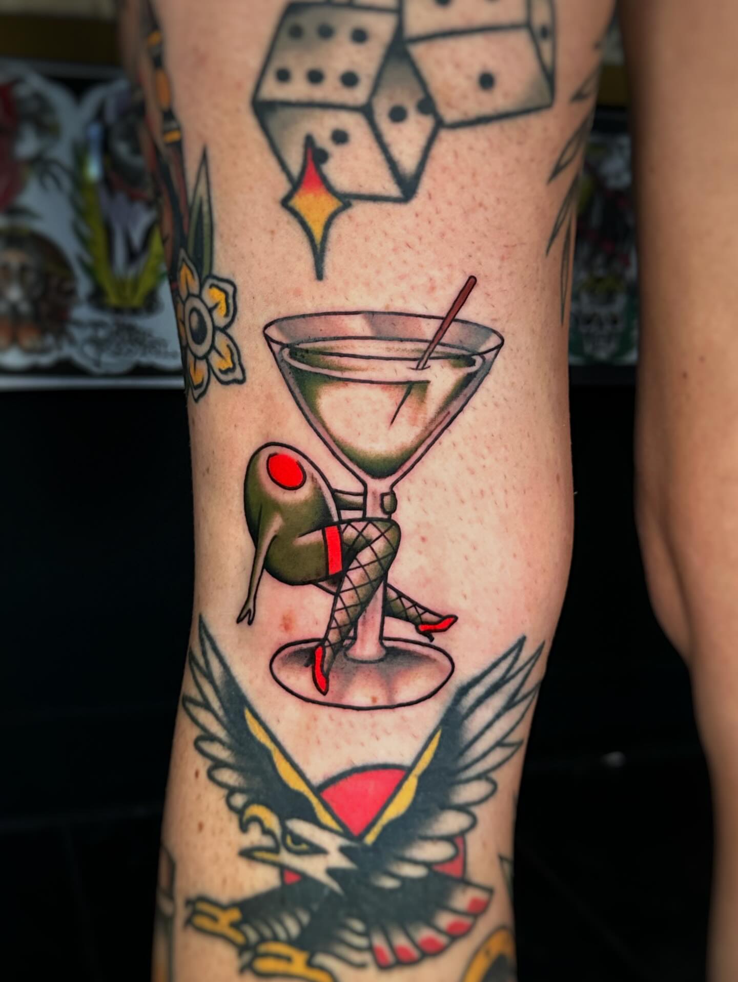 Martini glass with woman American traditional tattoo on the forearm by Alex Finnerty, Reading, Massachusetts