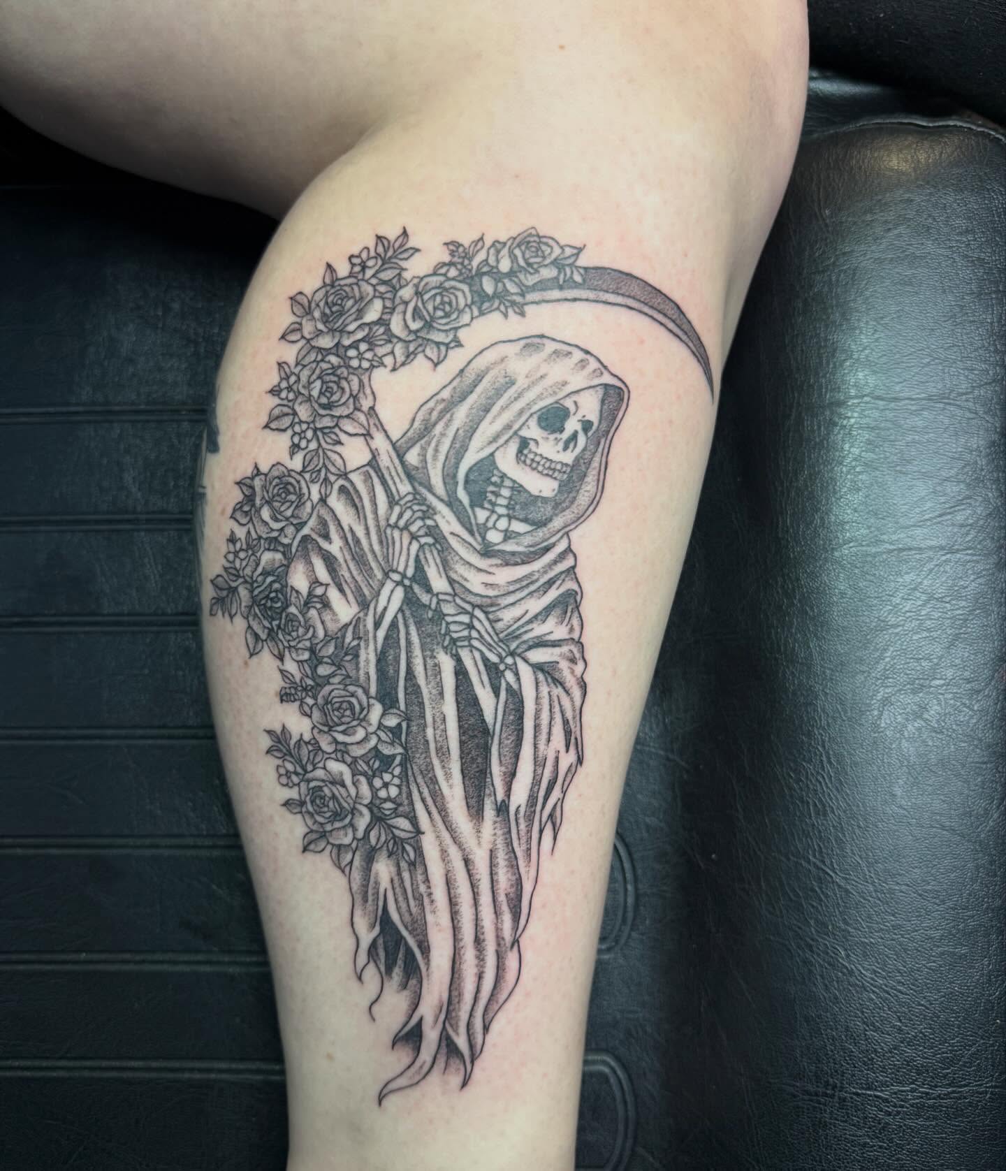 Reaper with roses realism tattoo on the thigh by Elena