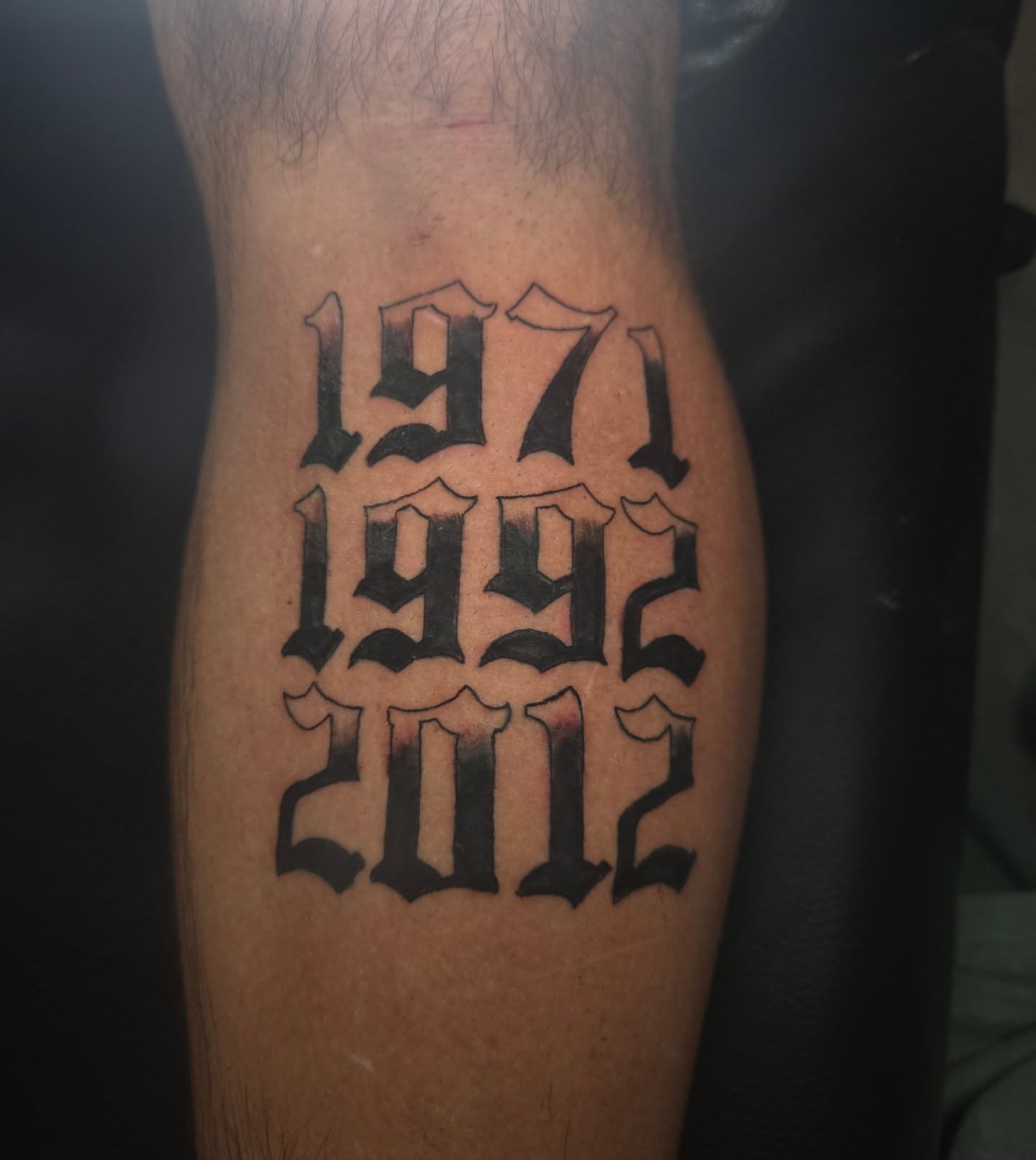 Years lettering script tattoo on the forearm by Lane