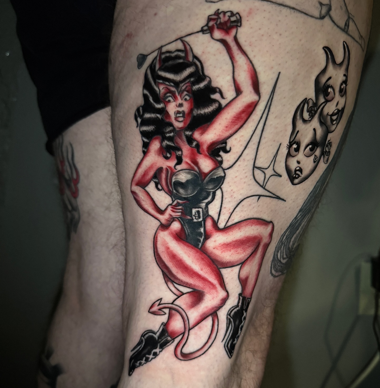 Devil pin-up girl American traditional tattoo on the thigh by @mexcellent_tattoos