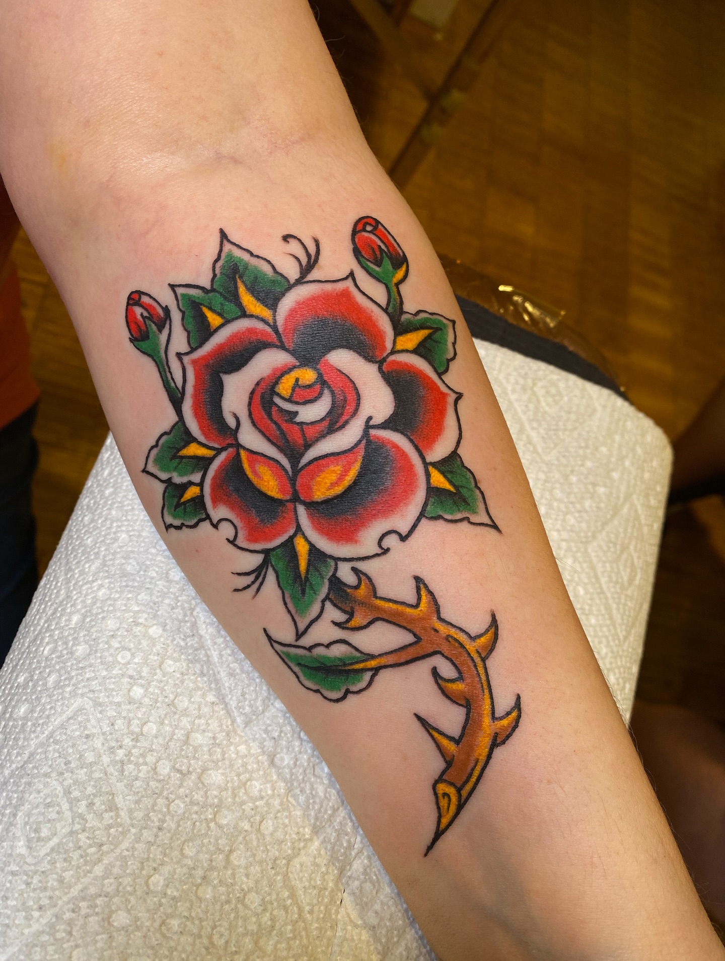 Rose American traditional tattoo on the forearm by Karl Hegwein, Portland, Oregon