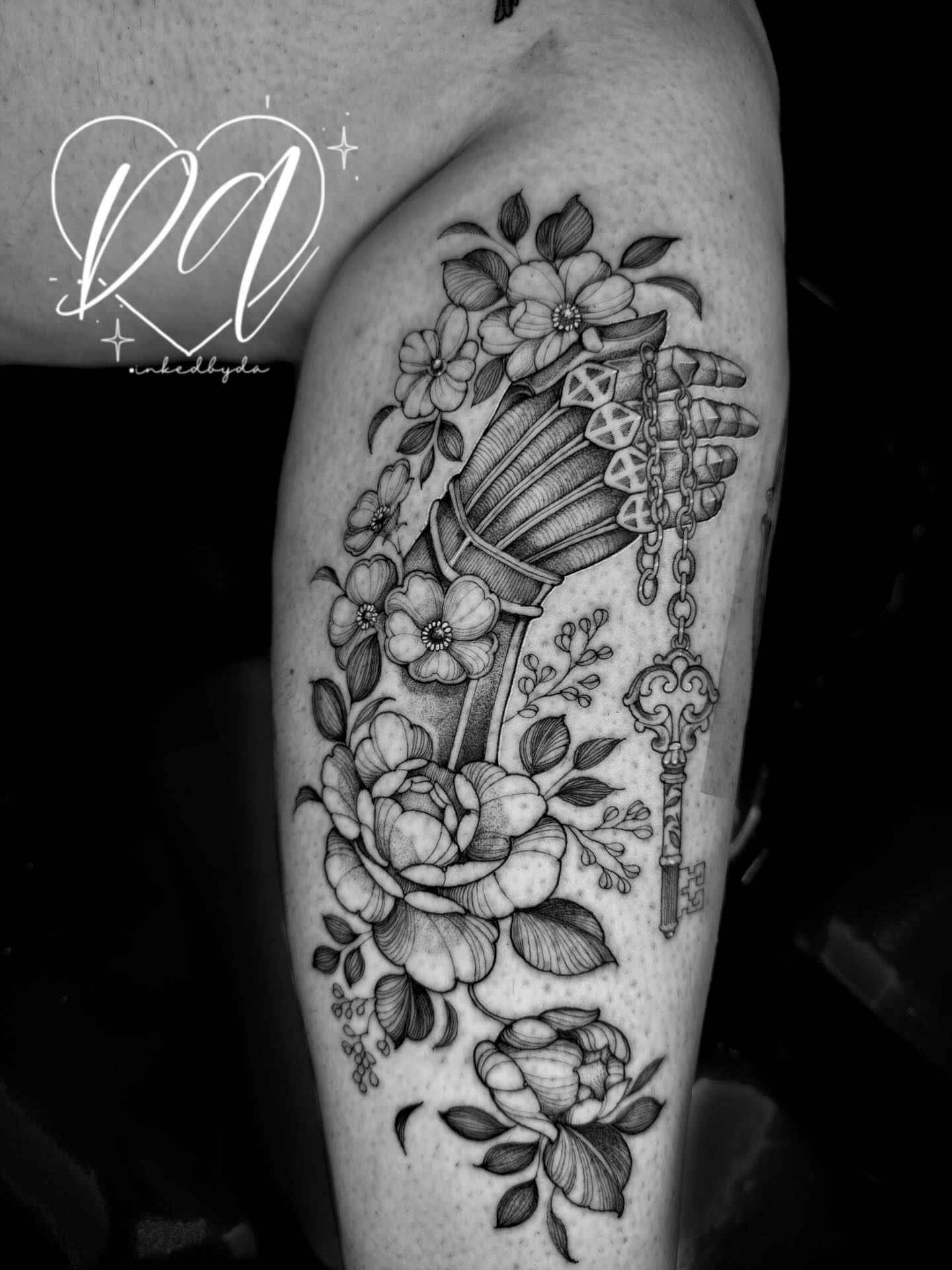 Floral bouquet with key realism tattoo on the forearm by Dalton Alexandria