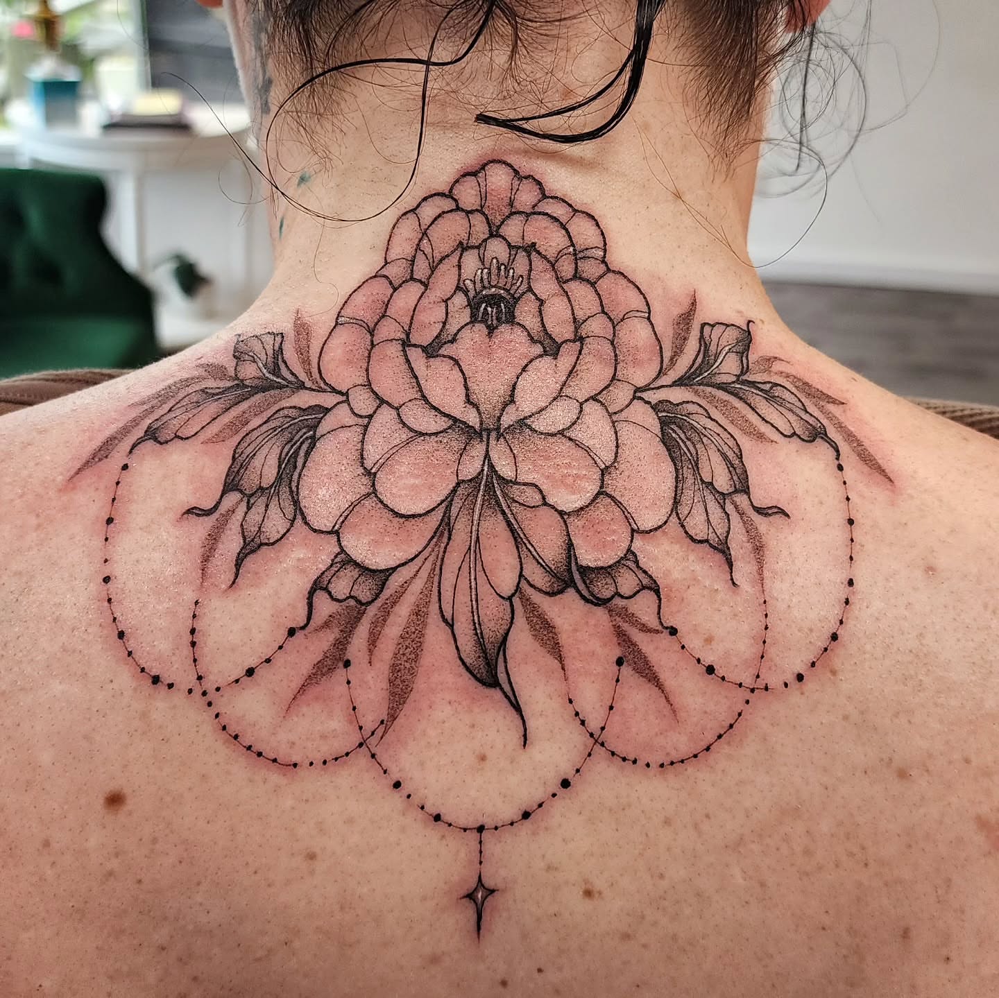 Peony dotwork tattoo on the neck by mikayla