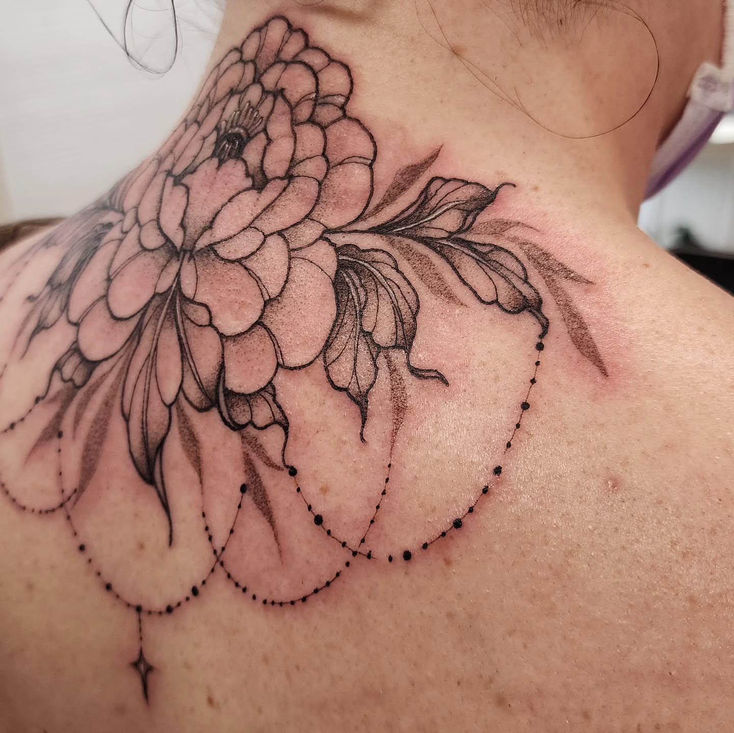 Peony flower dotwork tattoo on the neck by mikayla