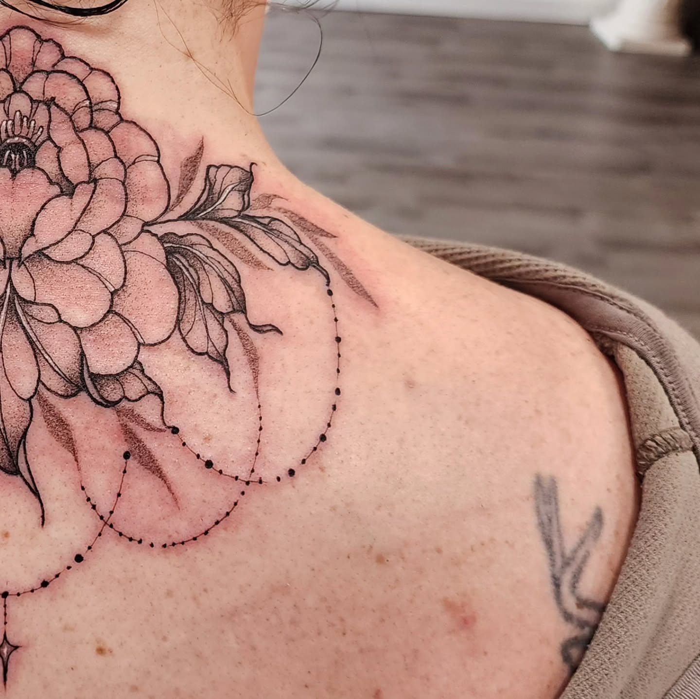 Flower dotwork tattoo on the shoulder by mikayla