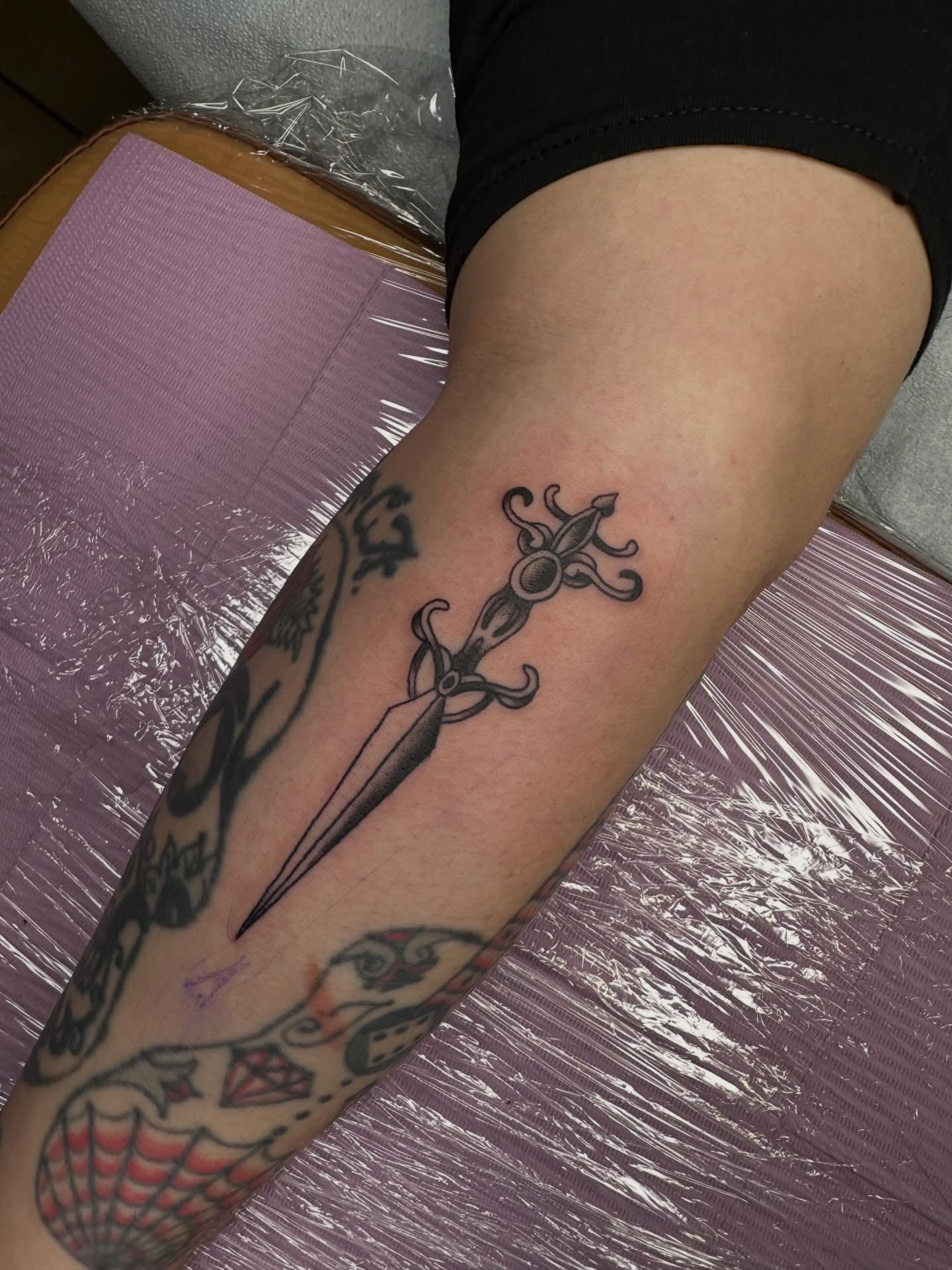 Sword black and grey tattoo on the forearm by Alex Gunshefski