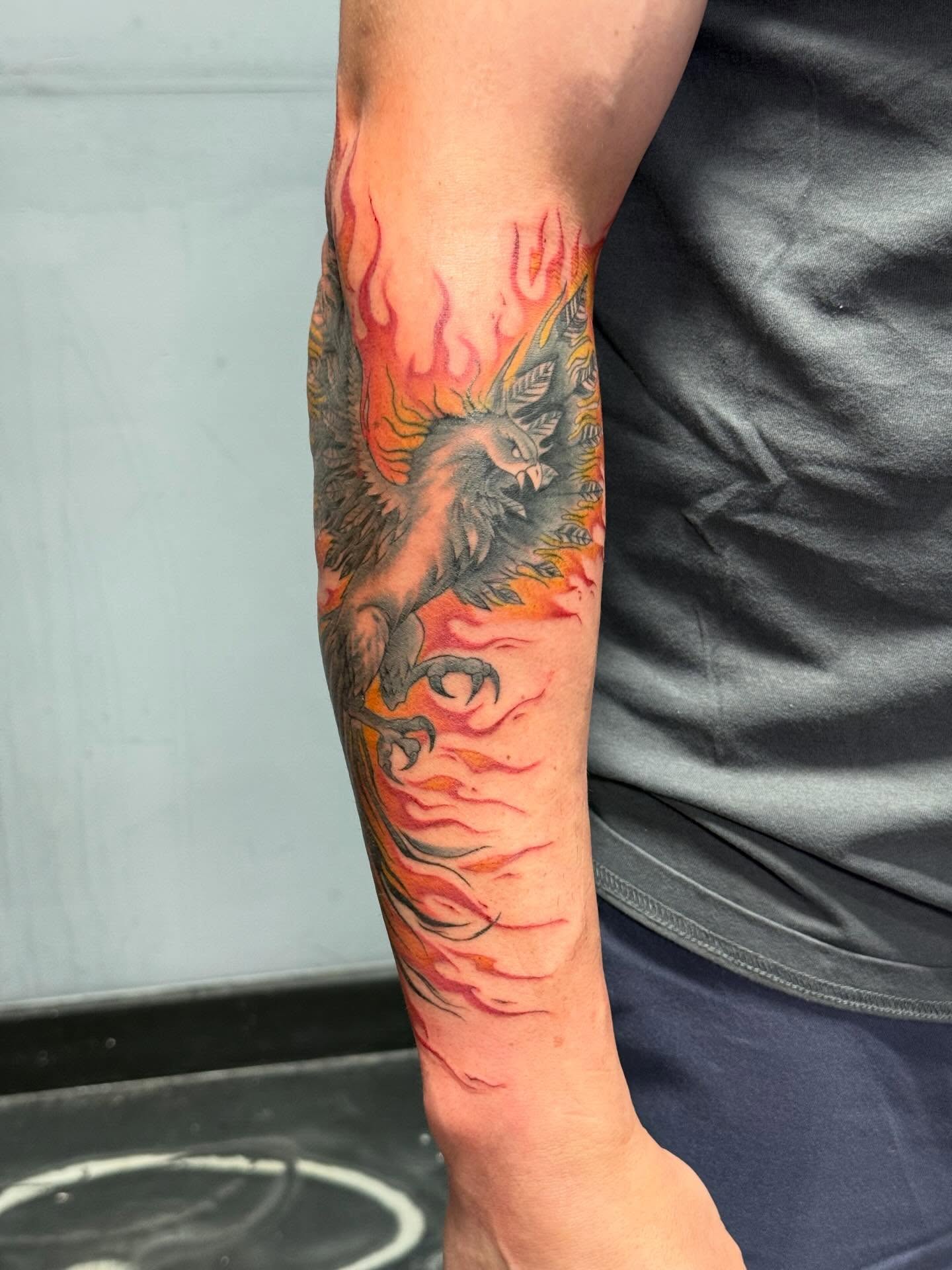 Bird in flames neo-traditional tattoo on the forearm by Katrina Aldaco 🧿 Tattoo Artist