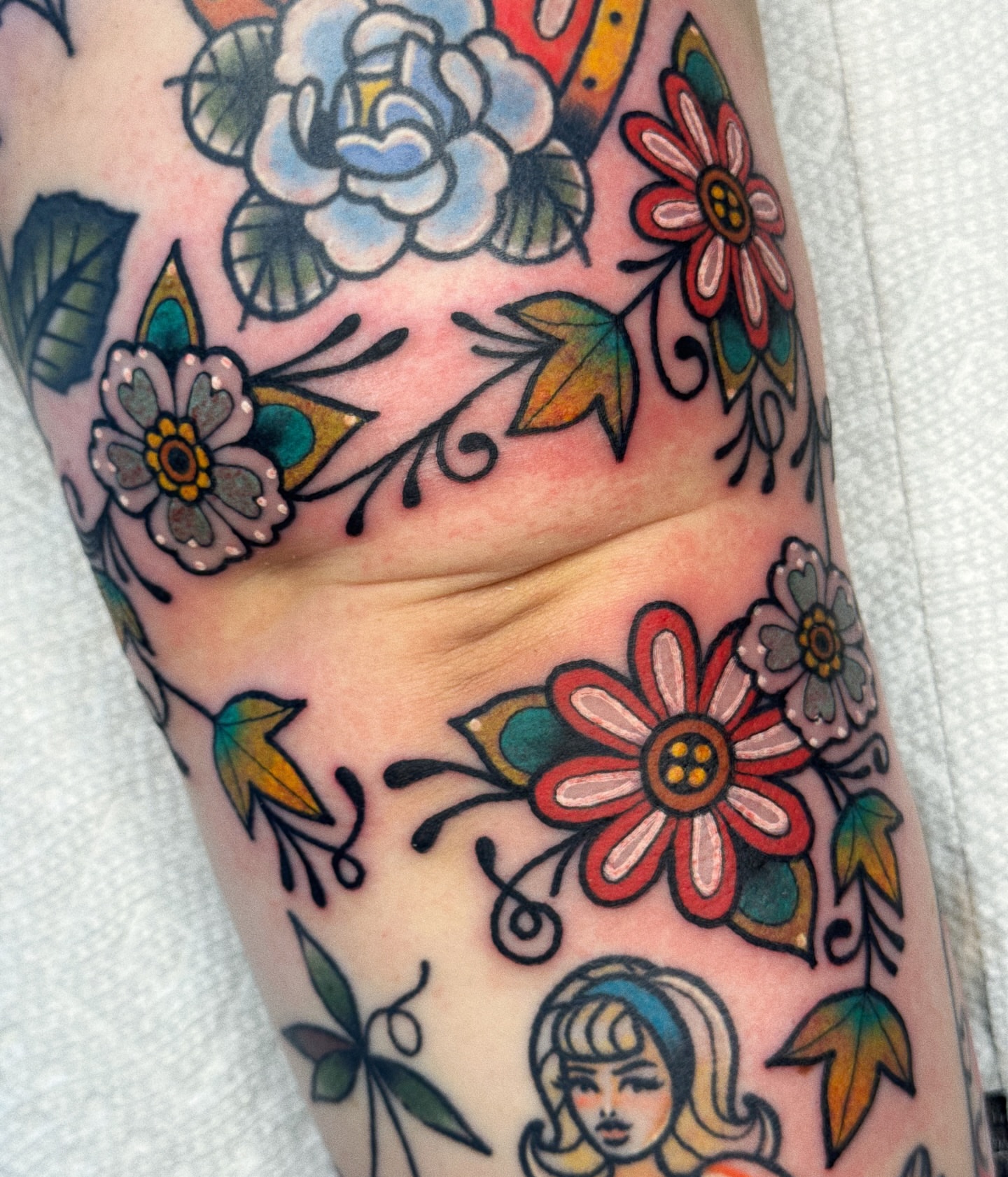 Floral arrangement American traditional tattoo on the forearm by 𝕷𝖆𝖚𝖗 𝕷𝖆𝖚𝖗