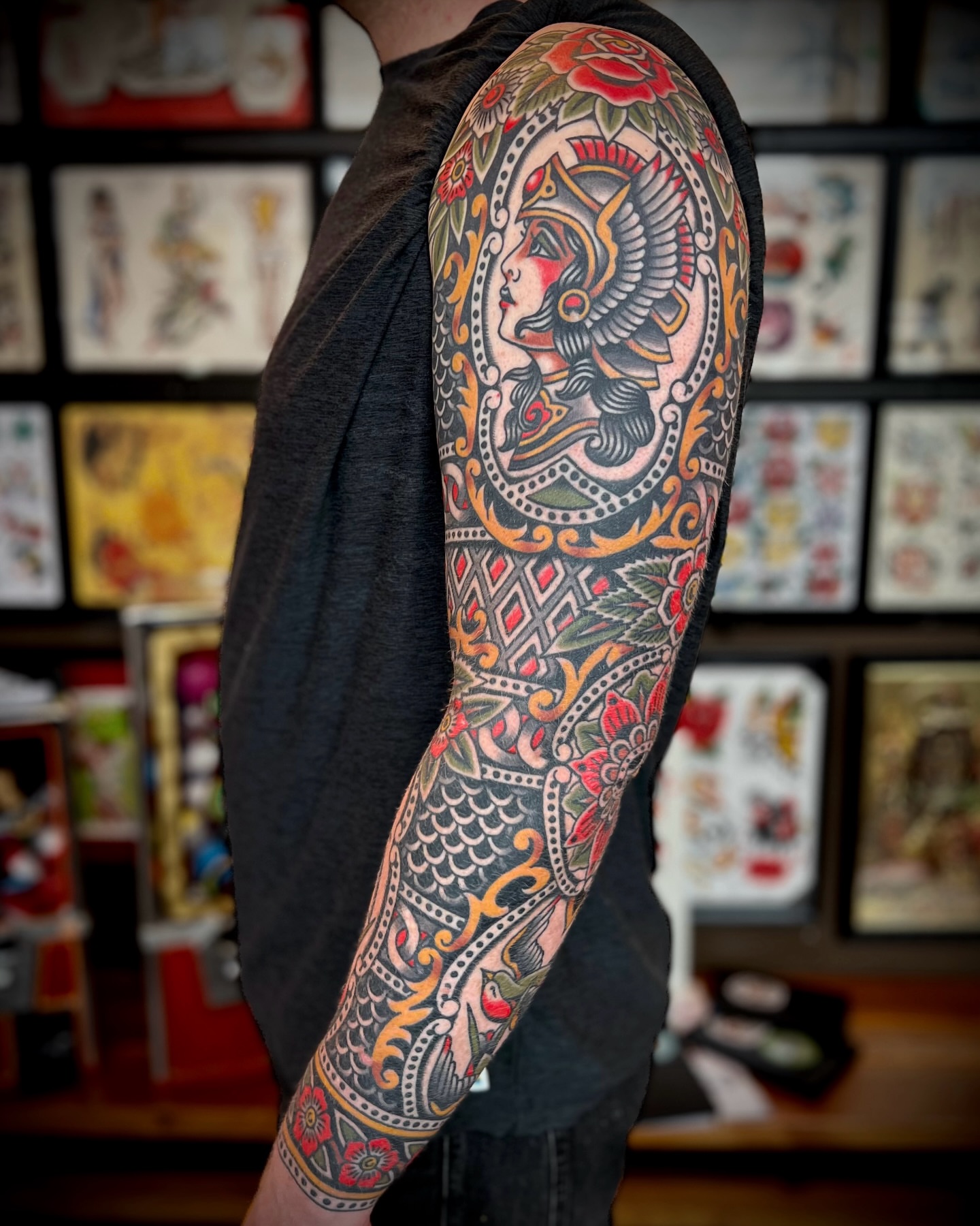 Woman with bird American traditional tattoo on the forearm by Brian Visser