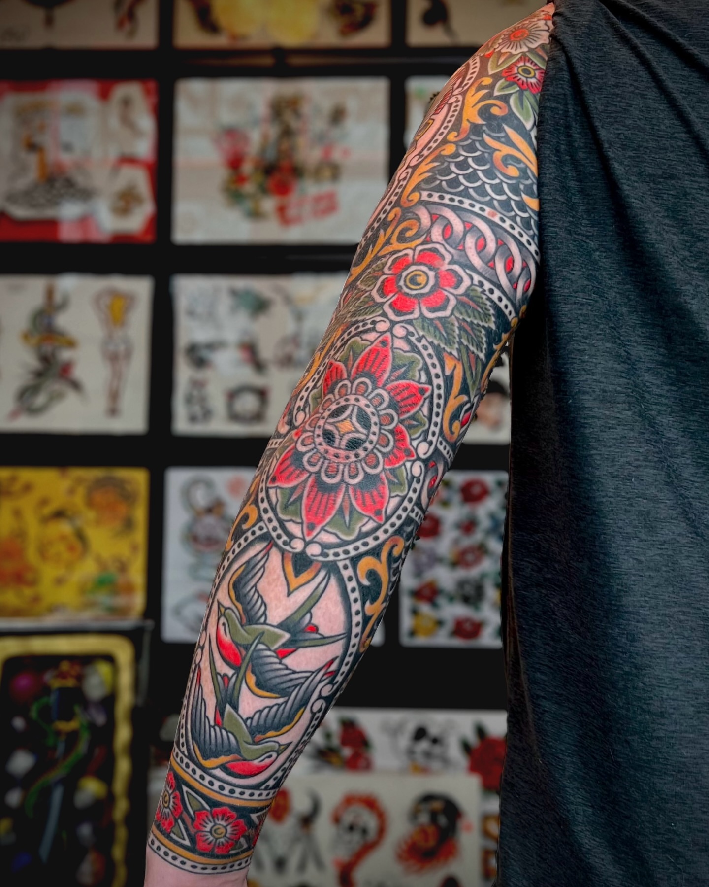 Floral sleeve American traditional tattoo on the upper arm by Brian Visser
