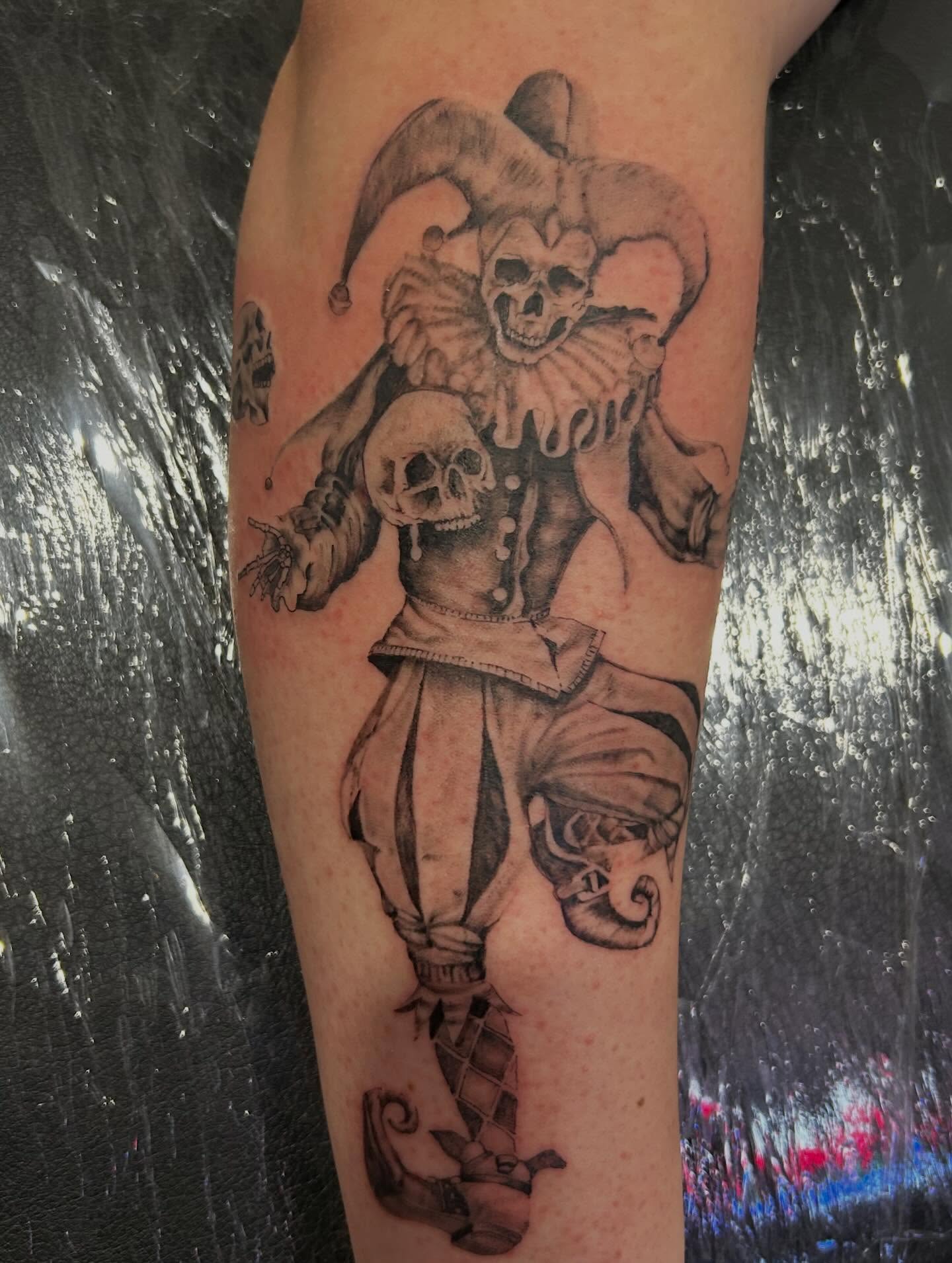 Jester and skull realism tattoo on the forearm by Jbtattoo Artistry