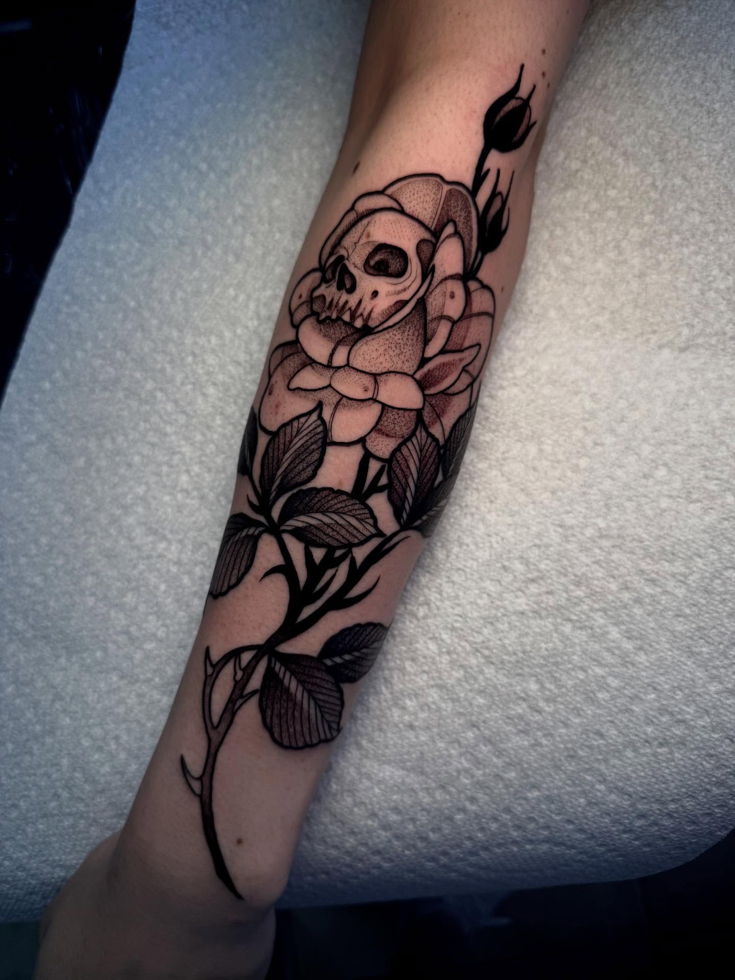 Skull and rose black and grey tattoo on the forearm by H A N N A H, Colorado Springs, Colorado