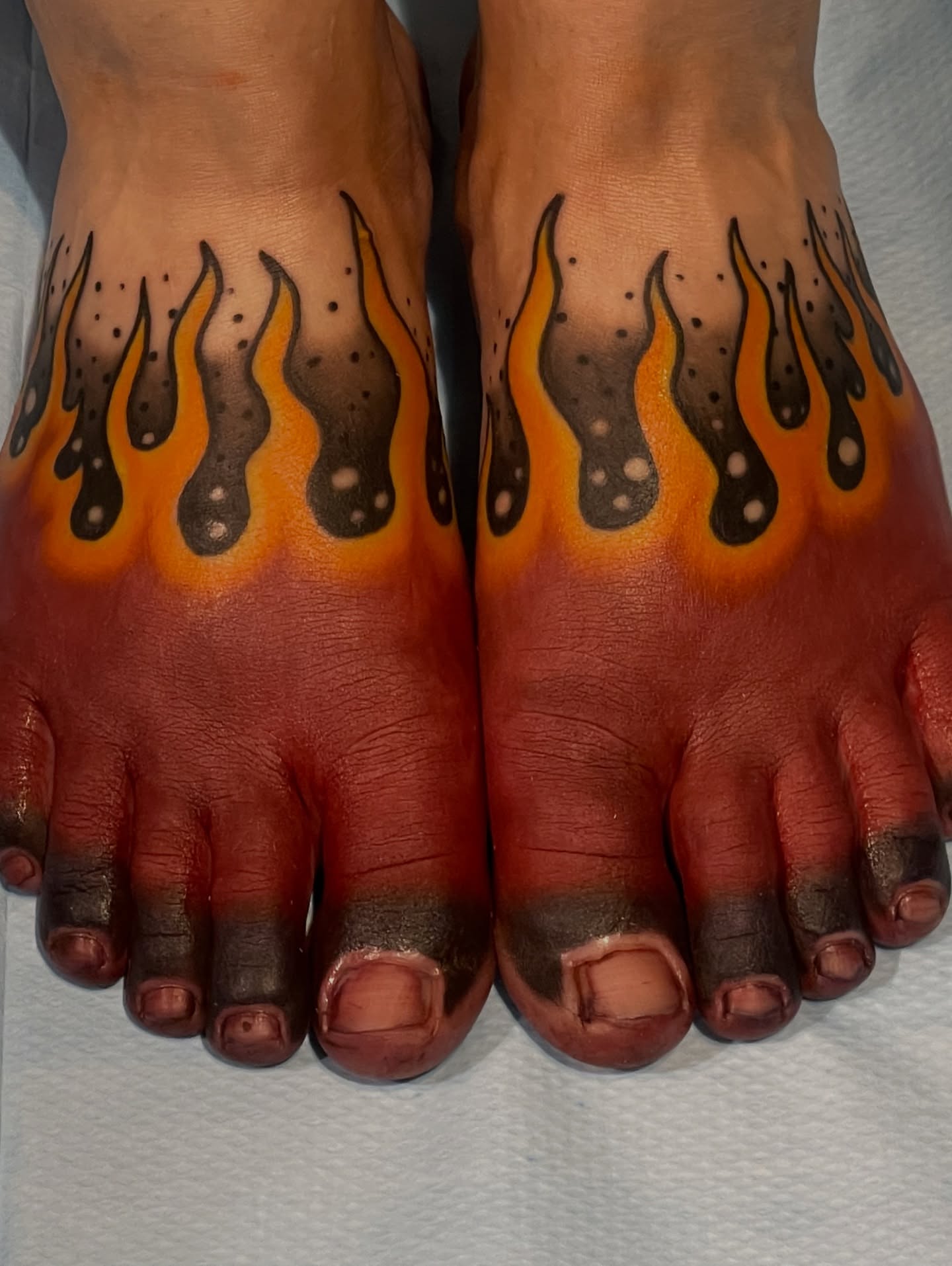 Flames dotwork tattoo on the foot by Dale Callahan, Olympia, Washington