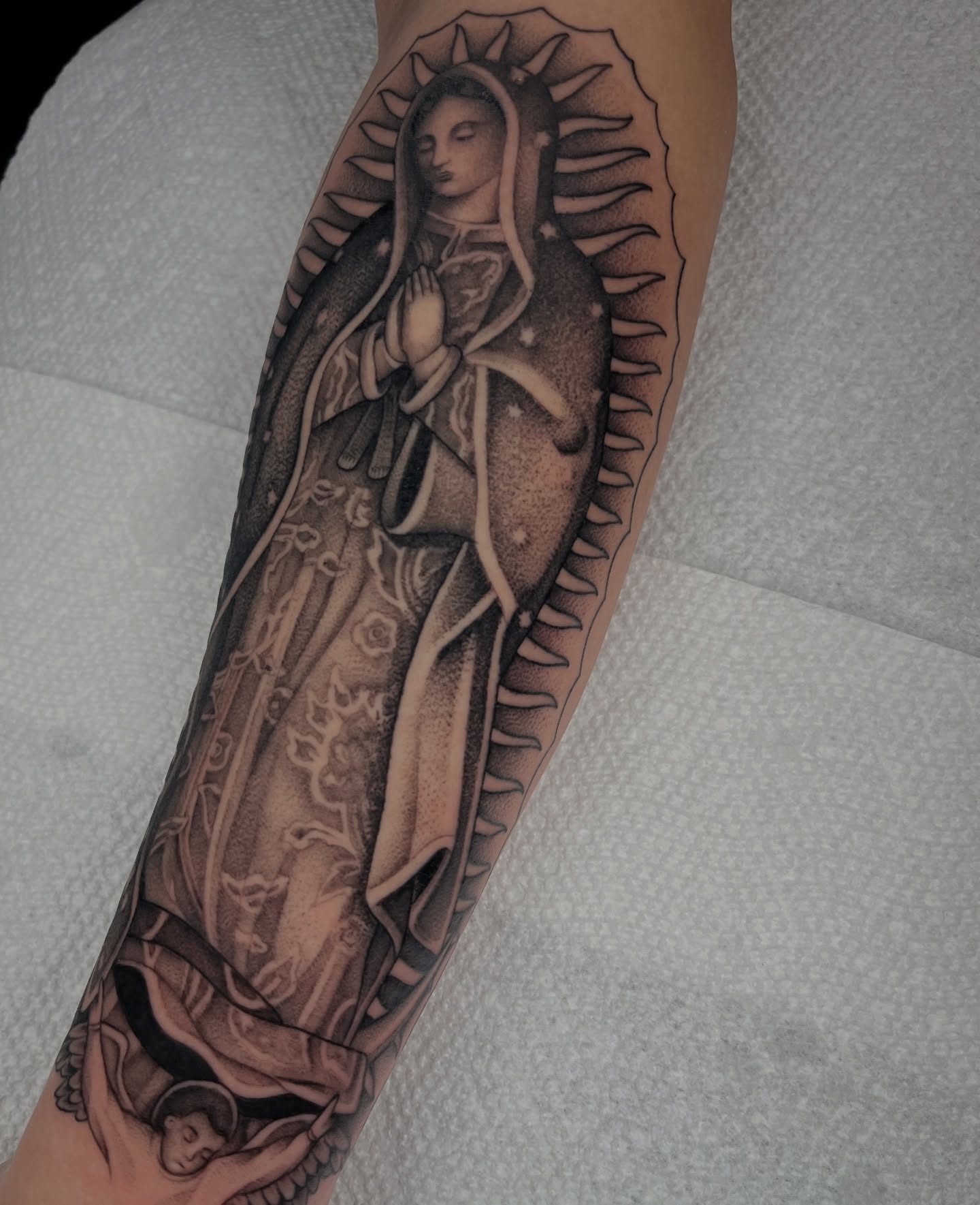 Our Lady of Guadalupe realism tattoo on the forearm by Jordan Hunt