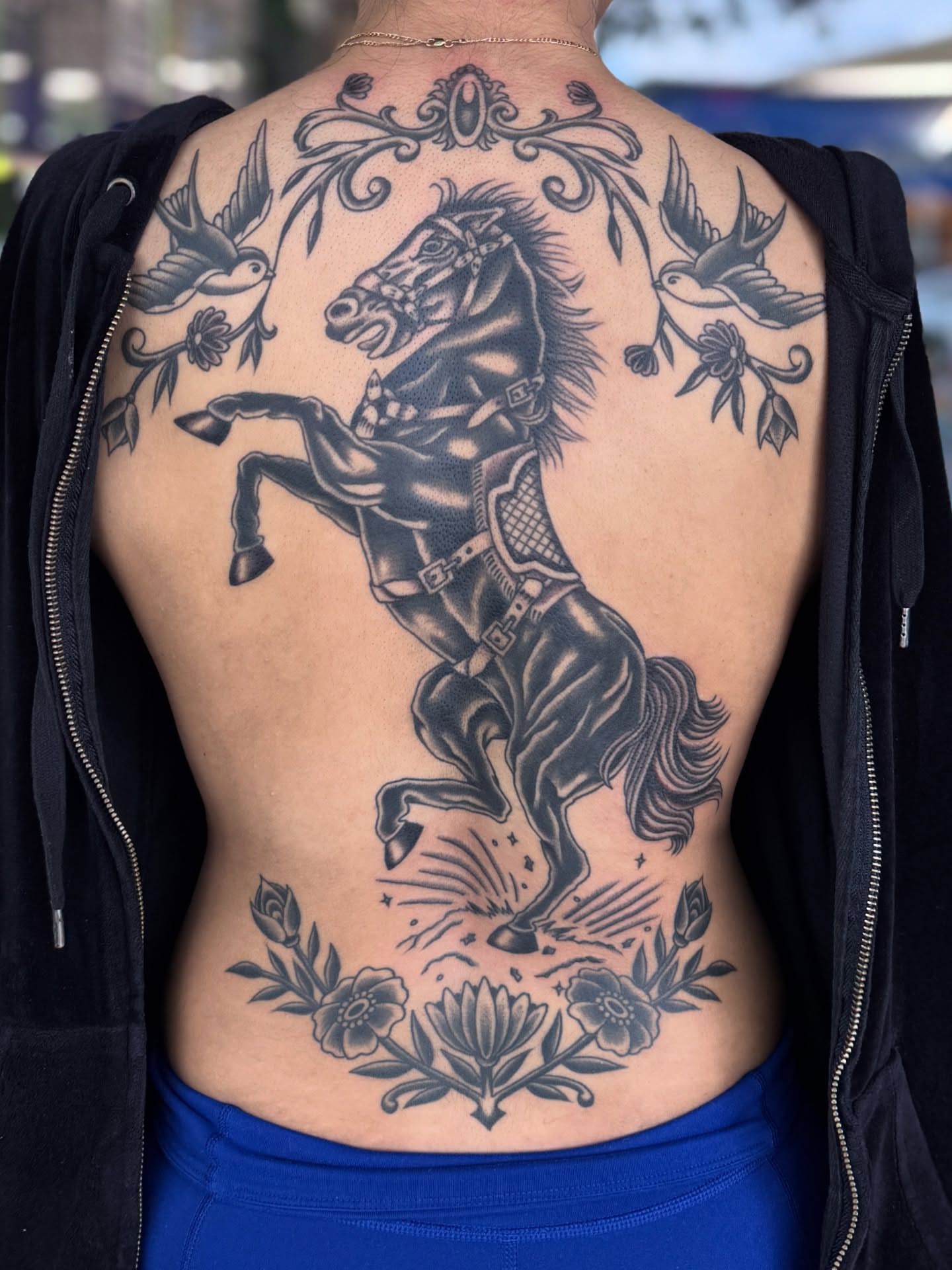 Galloping horse American traditional tattoo on the back by Sarah Pham