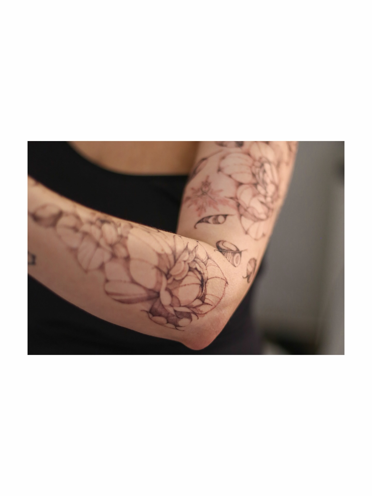 Floral bouquet black and grey tattoo on the forearm by Inna Petrova, Kitchener, Ontario