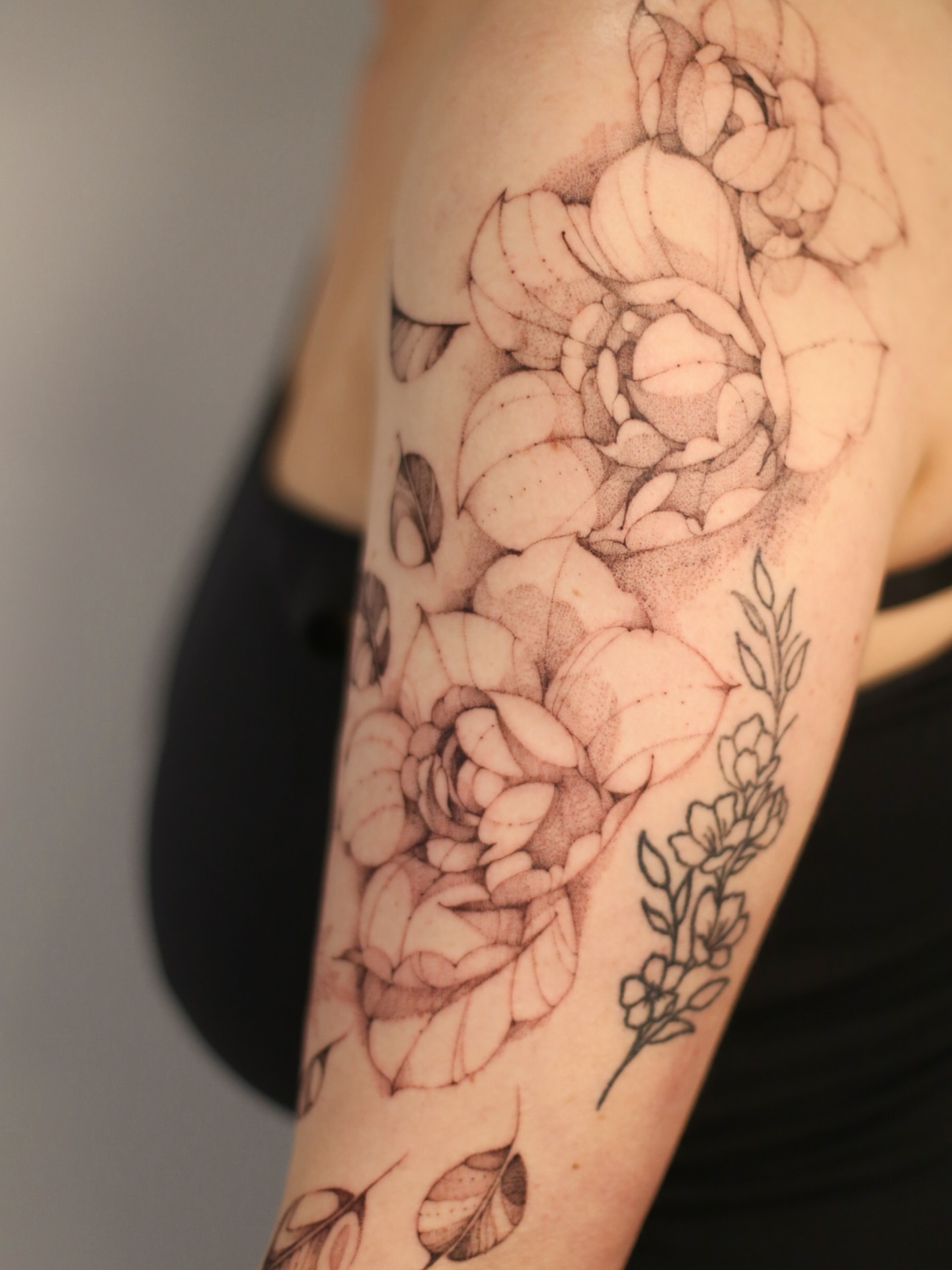 Floral bouquet dotwork tattoo on the forearm by Inna Petrova, Kitchener, Ontario