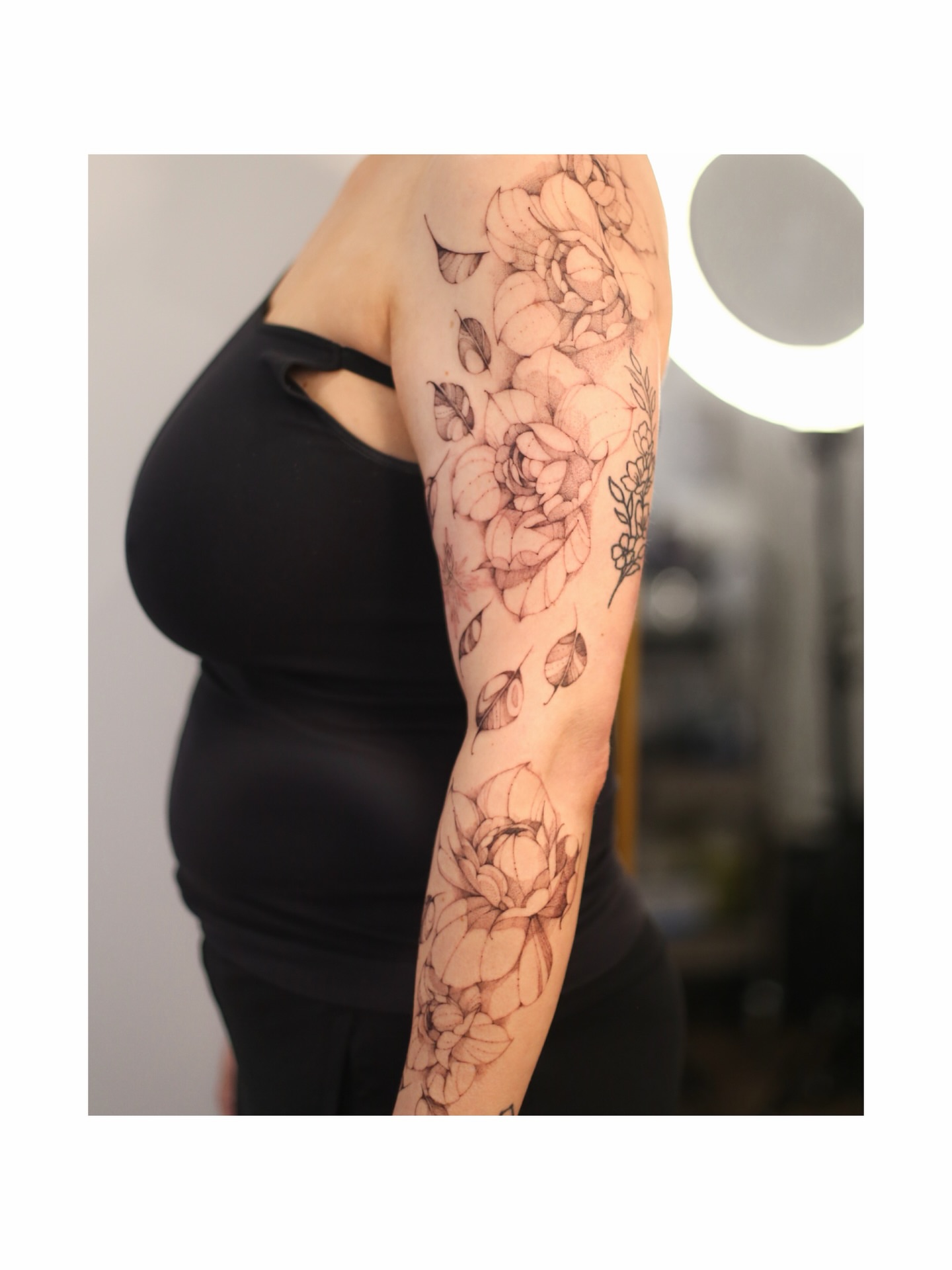Floral bouquet black and grey tattoo on the forearm by Inna Petrova, Kitchener, Ontario