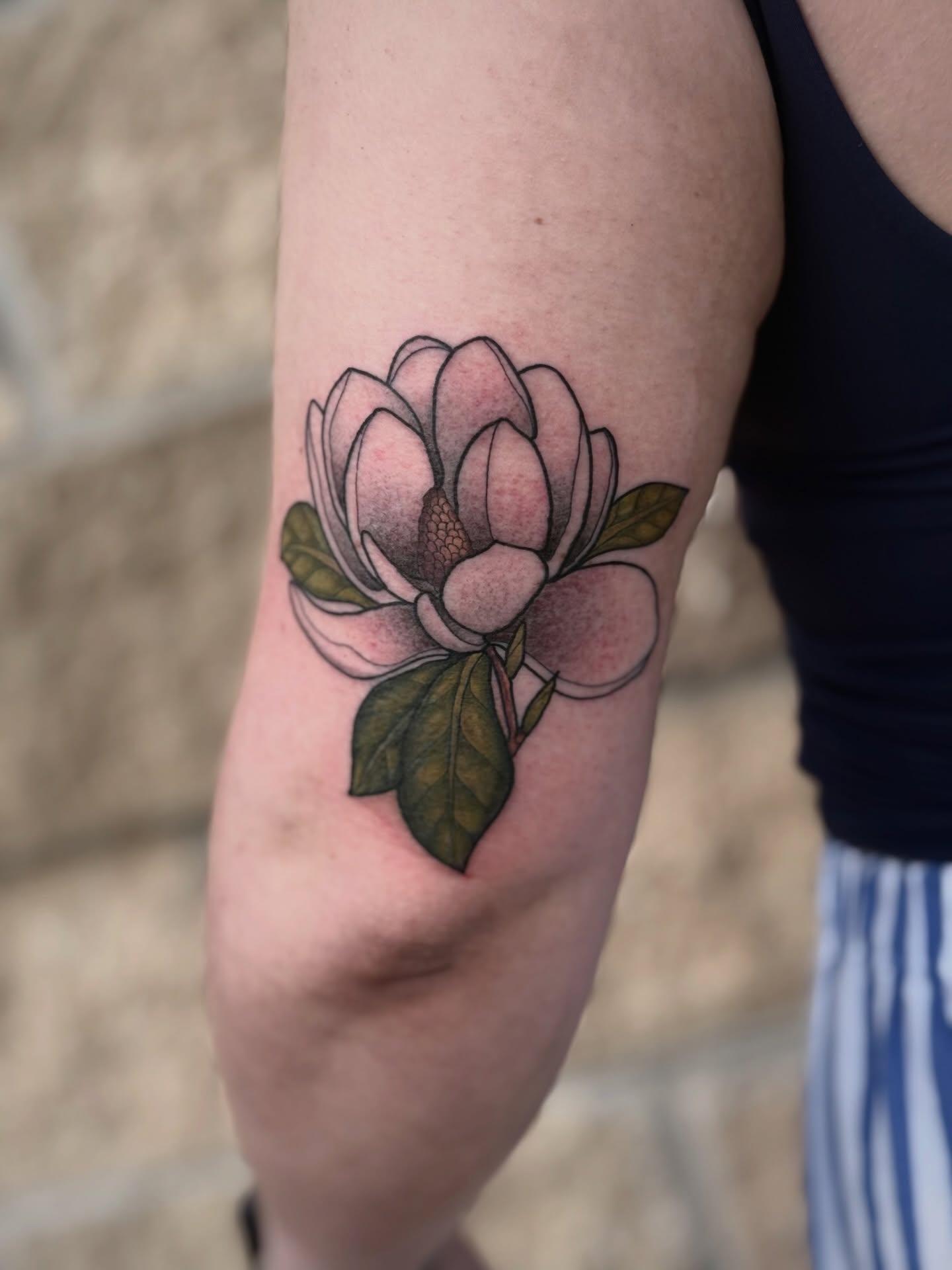 Magnolia flower realism tattoo on the forearm by K9