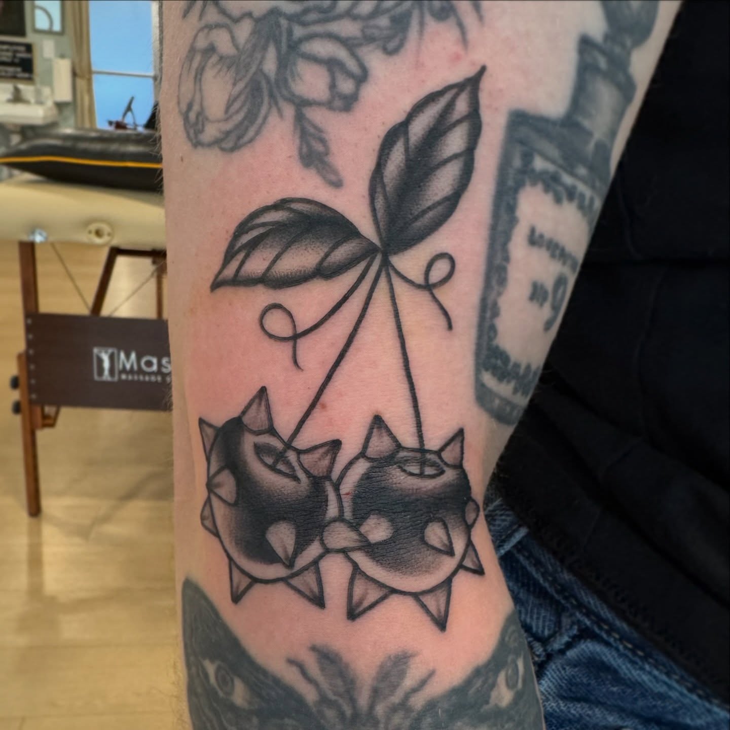 Balloon plant black and grey tattoo on the forearm by Kaley, Des Moines, Iowa