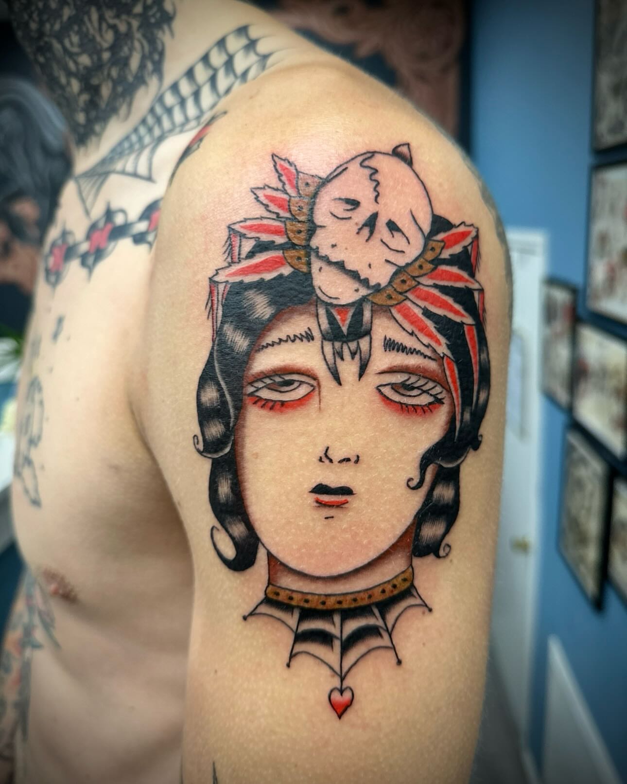 Woman with mask American traditional tattoo on the shoulder by rory