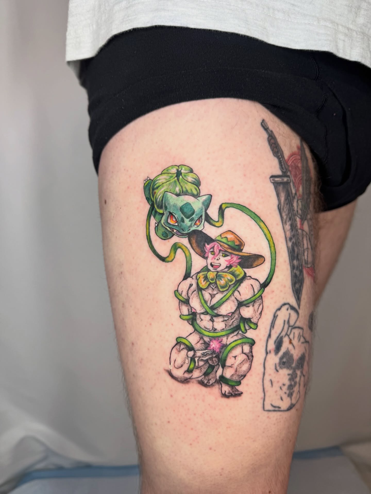 Snake and man new school tattoo on the thigh by Franky A Bonifacio, Seattle, Washington