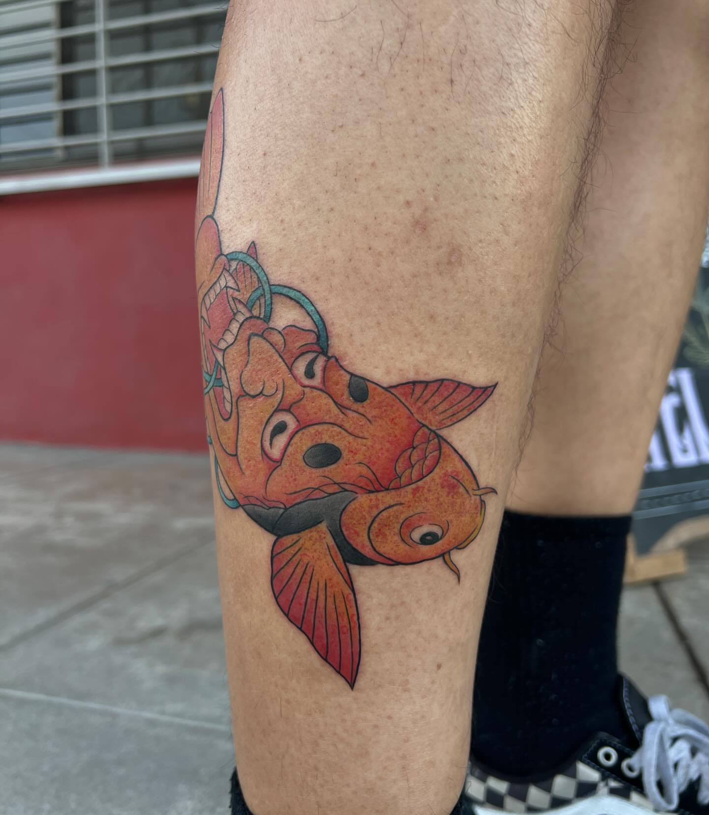 Koi fish American traditional tattoo on the thigh by Diana García