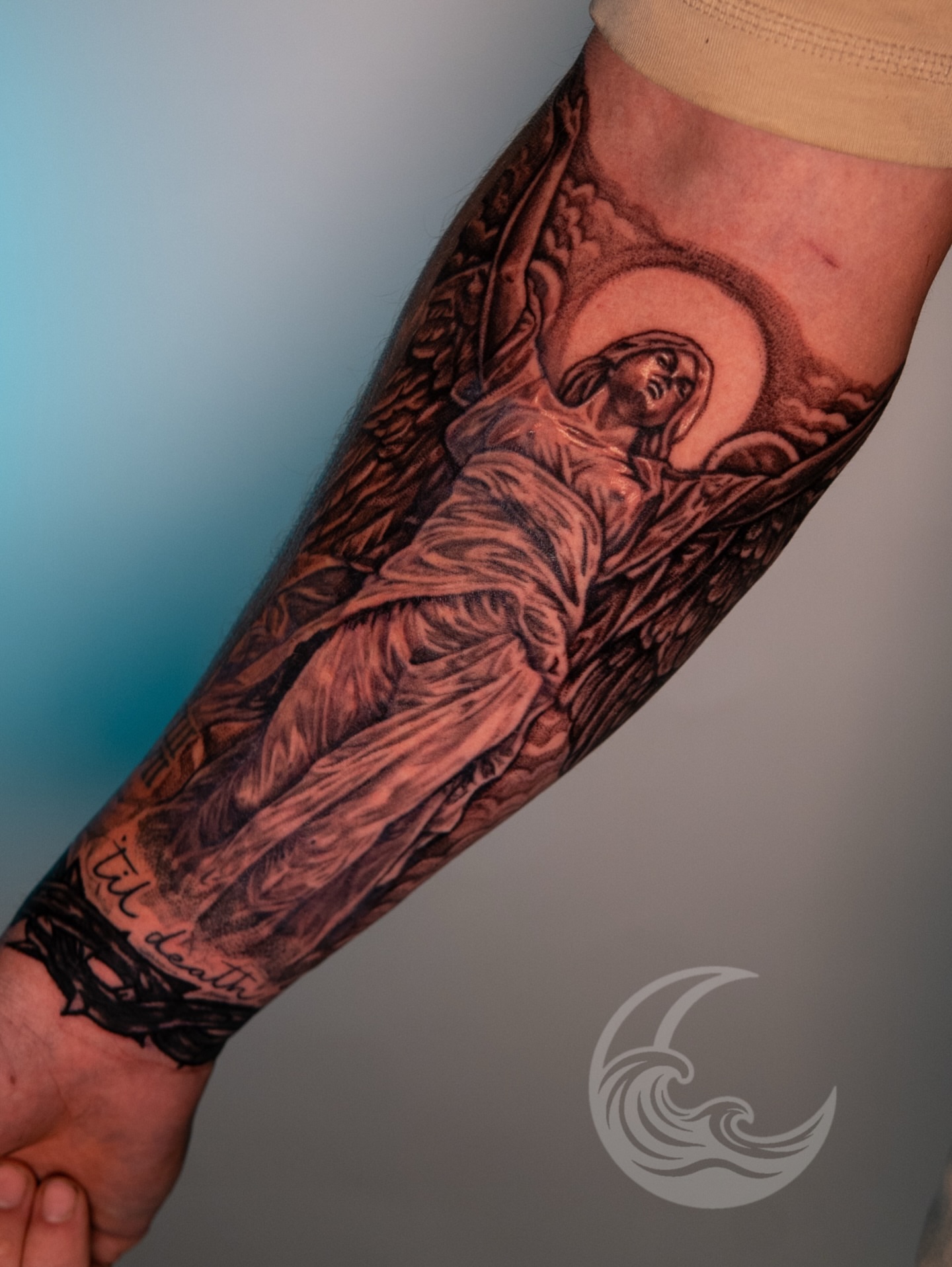 Religious figure black and grey tattoo on the forearm by Justin custard Tattoo💉Artist 🎨Painter