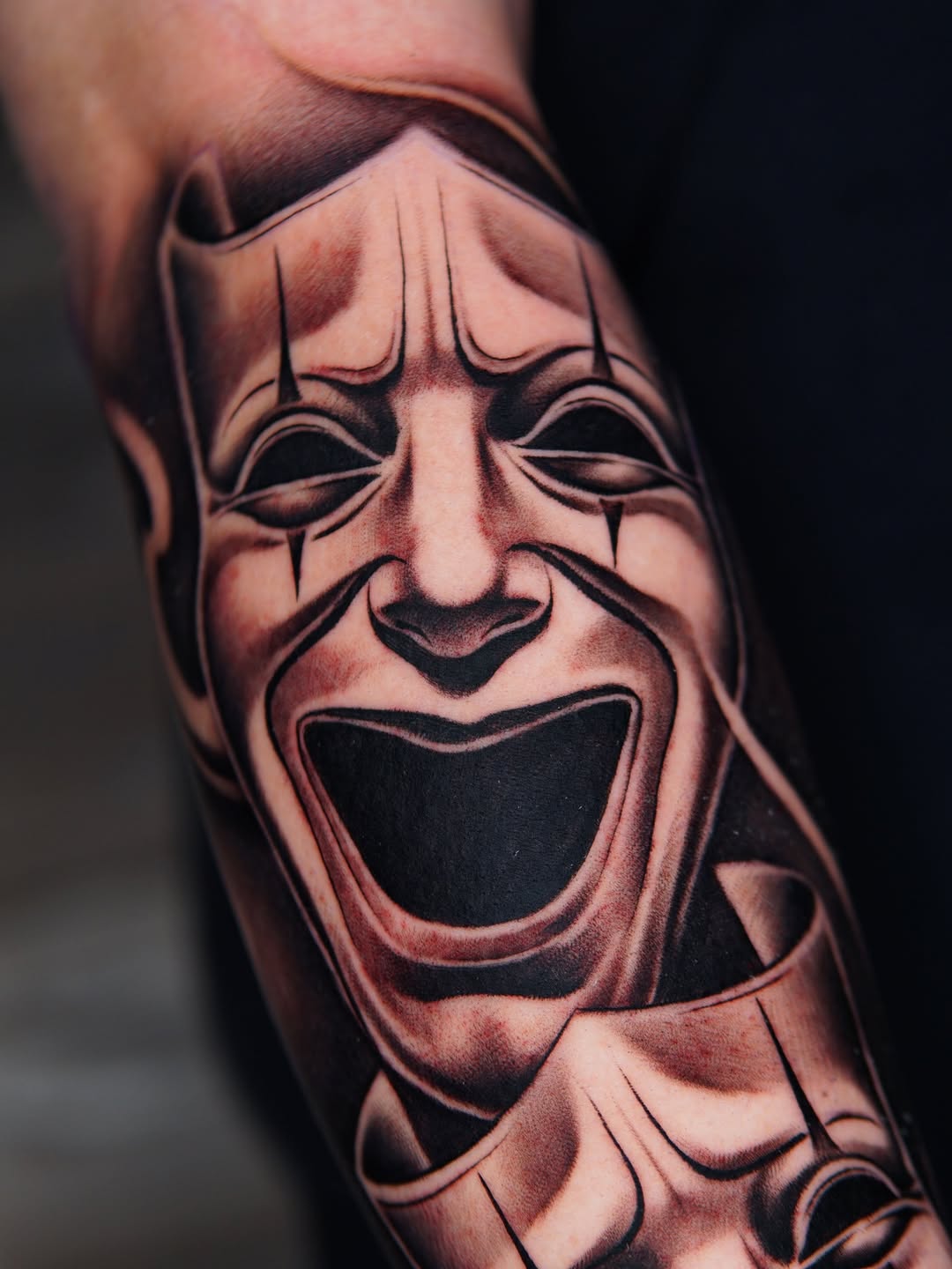 Comedy and tragedy masks realism tattoo on the forearm by Atlanta Tattoo Artist, Atlanta, Georgia