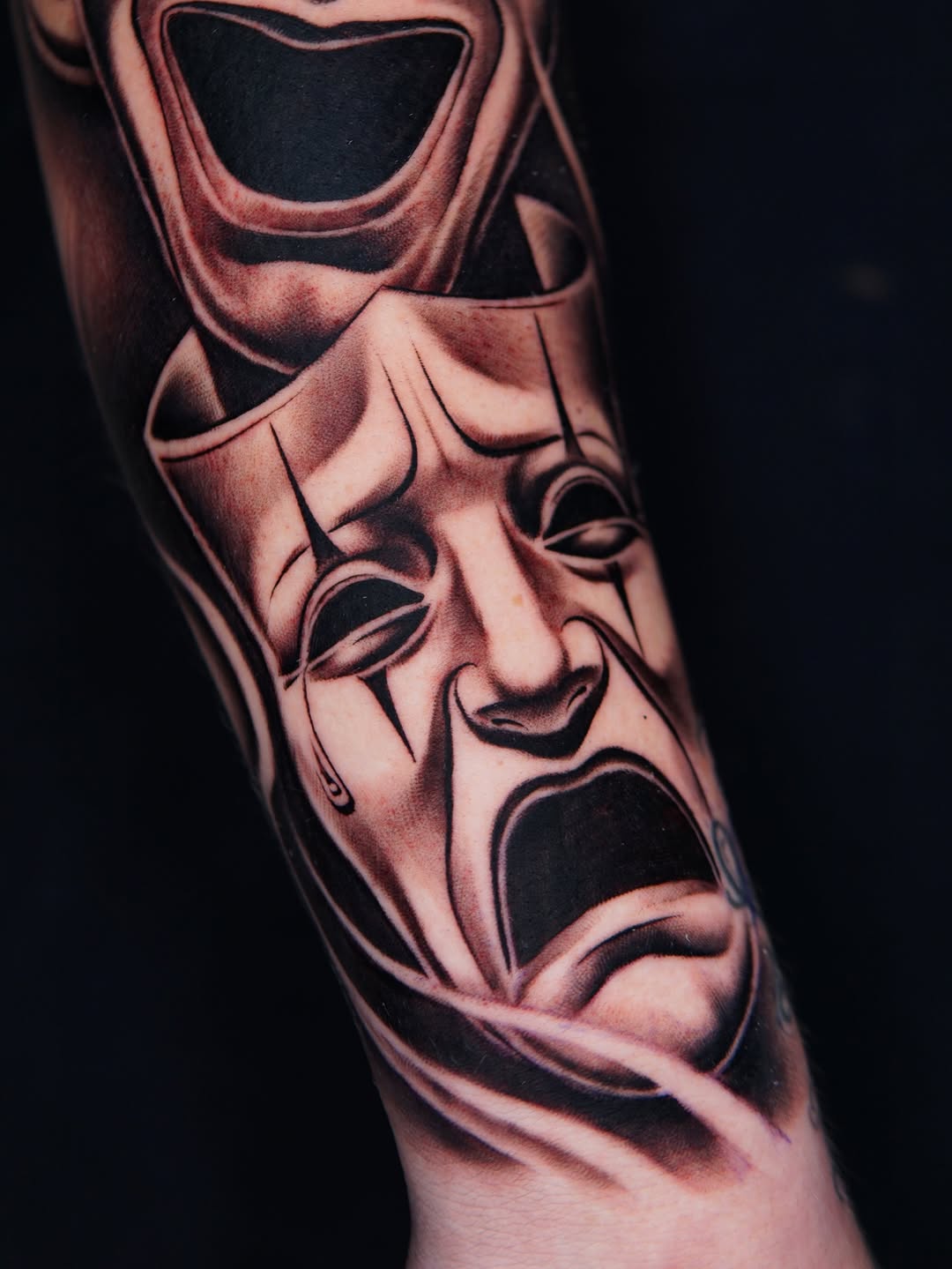 Comedy and tragedy masks realism tattoo on the forearm by Atlanta Tattoo Artist, Atlanta, Georgia