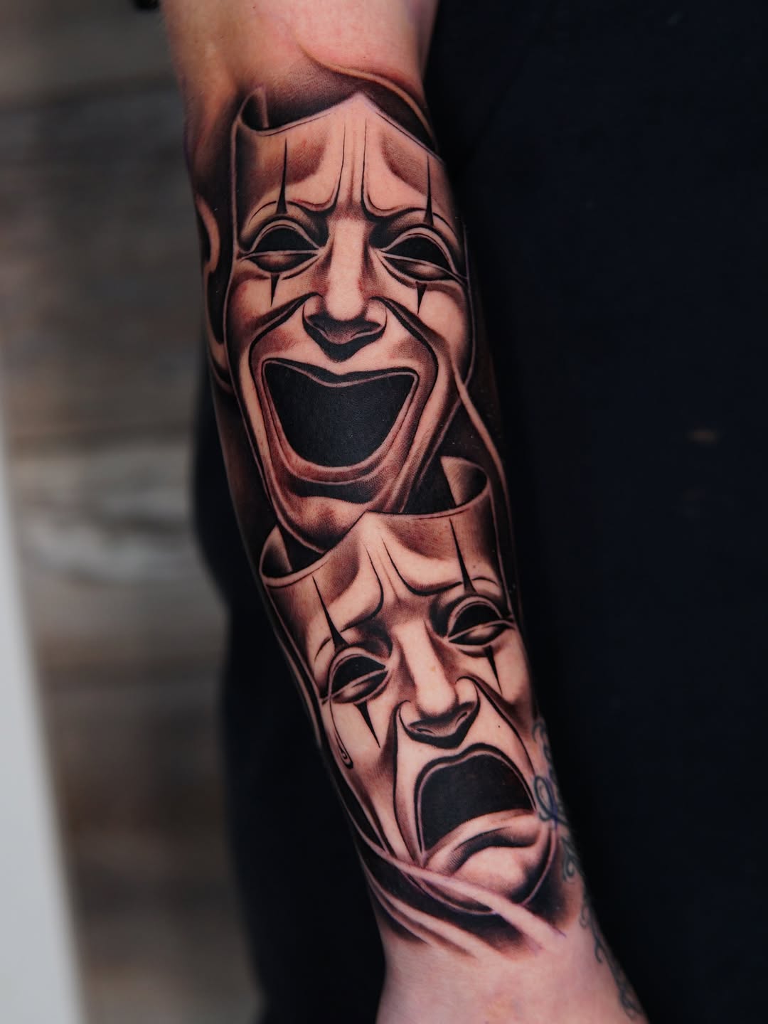 Comedy and tragedy masks realism tattoo on the forearm by Atlanta Tattoo Artist, Atlanta, Georgia